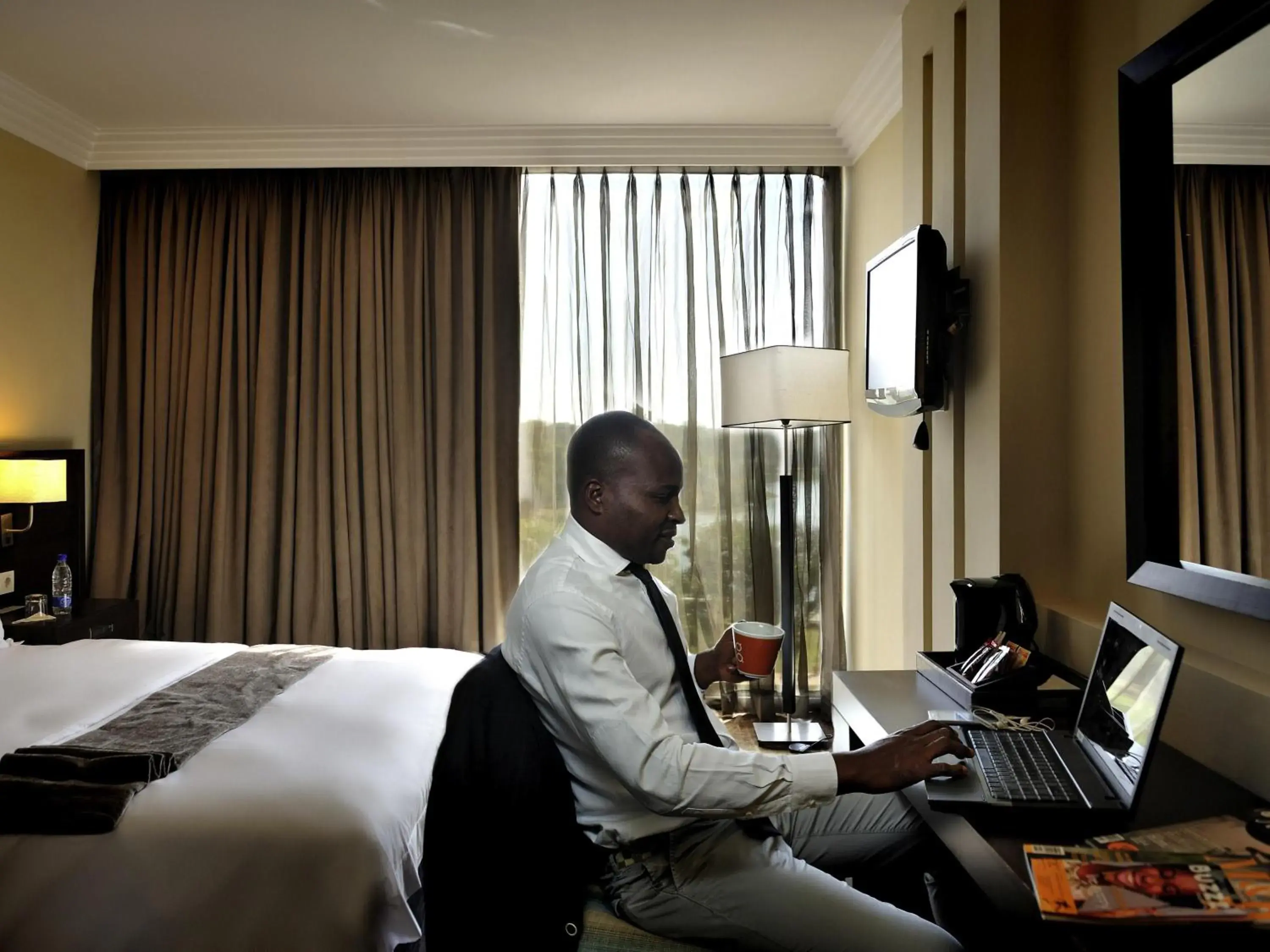 Bedroom, Bed in Pullman Lubumbashi Grand Karavia. Bedroom, Bed in Pullman Lubumbashi Grand Karavia.