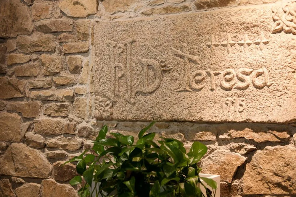 Property logo or sign in Hotel Doña Teresa