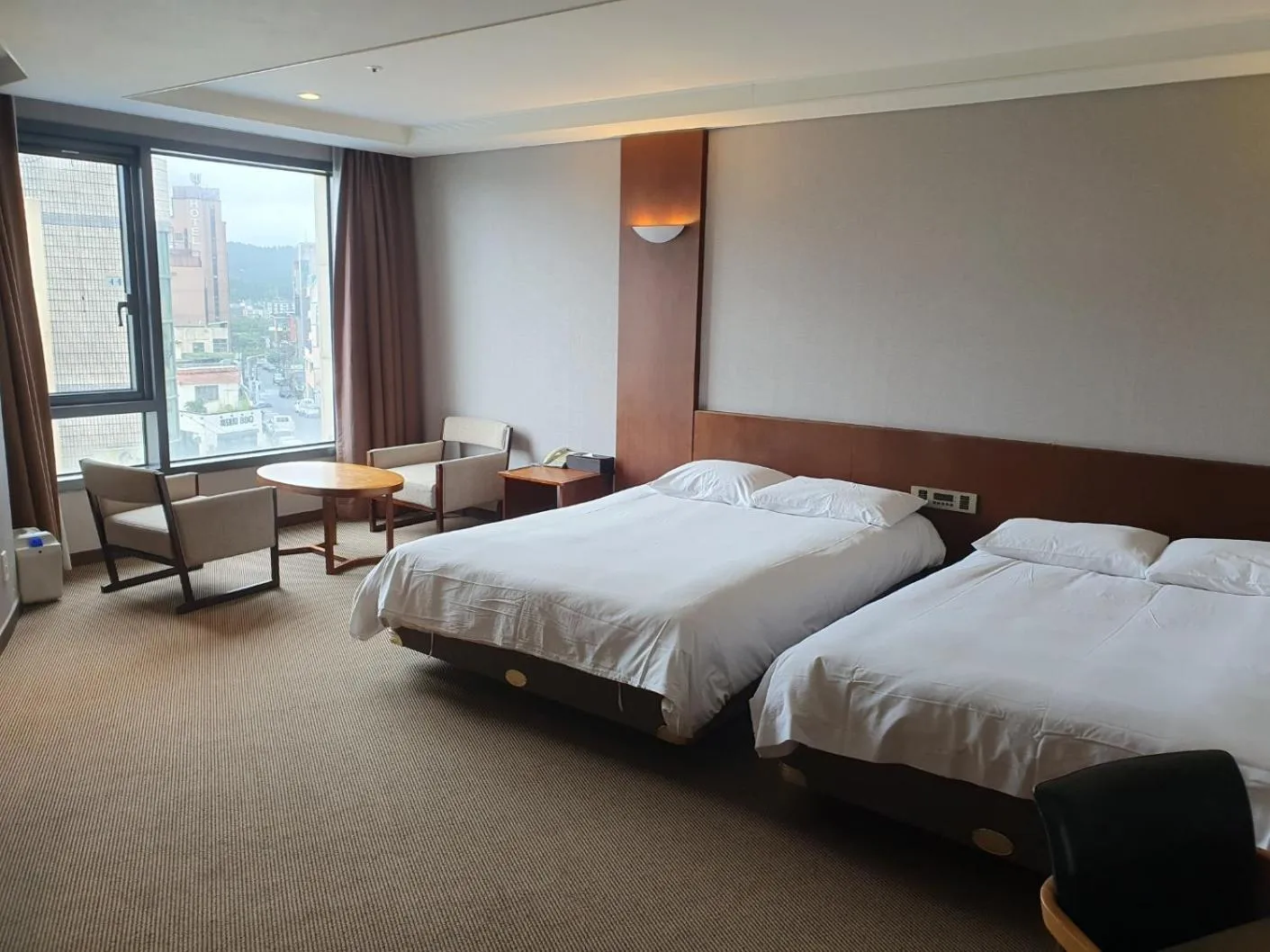 Living room, Bed in Mstay Hotel