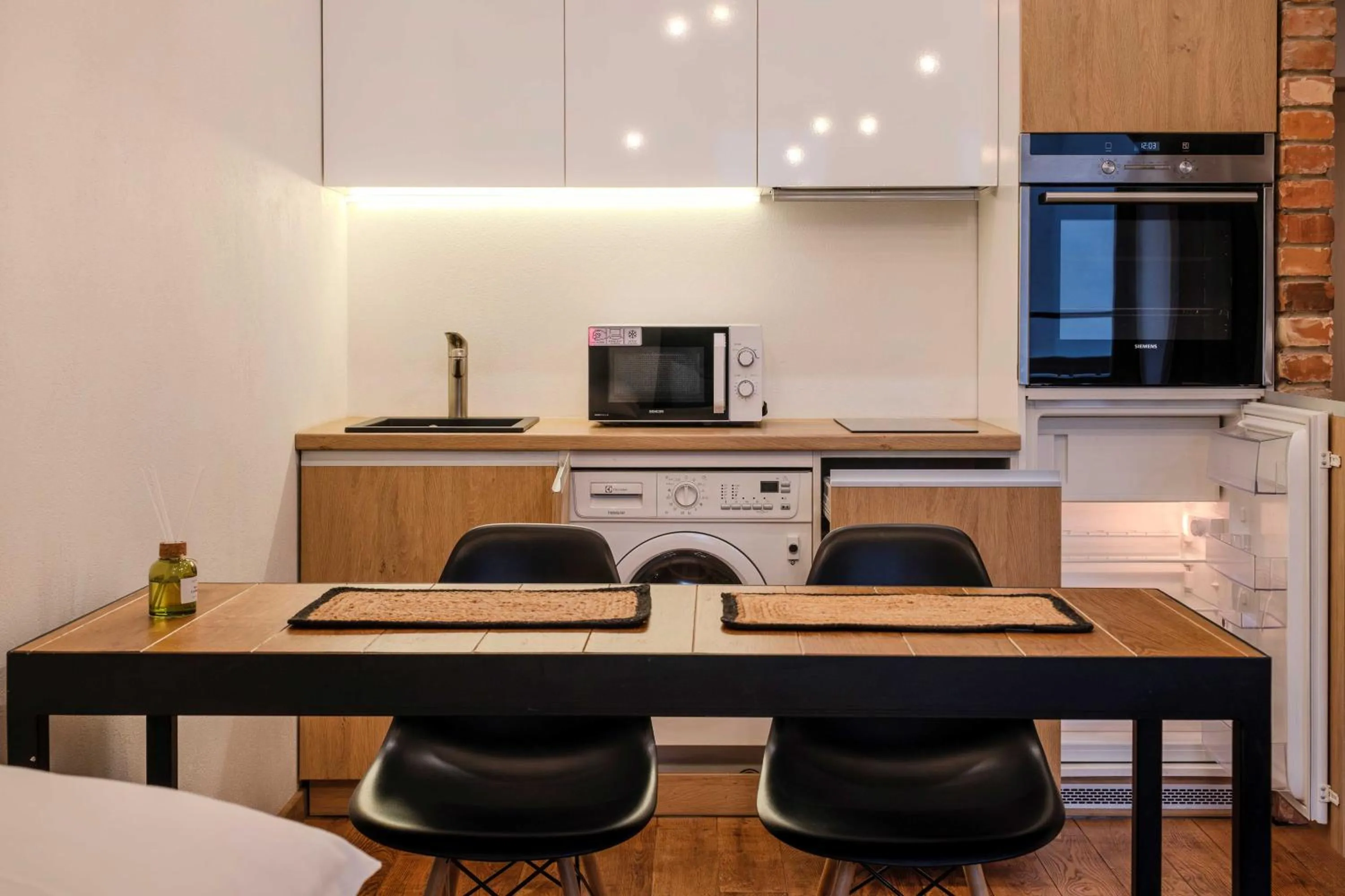 Kitchen or kitchenette in King Mindaugas Apartments