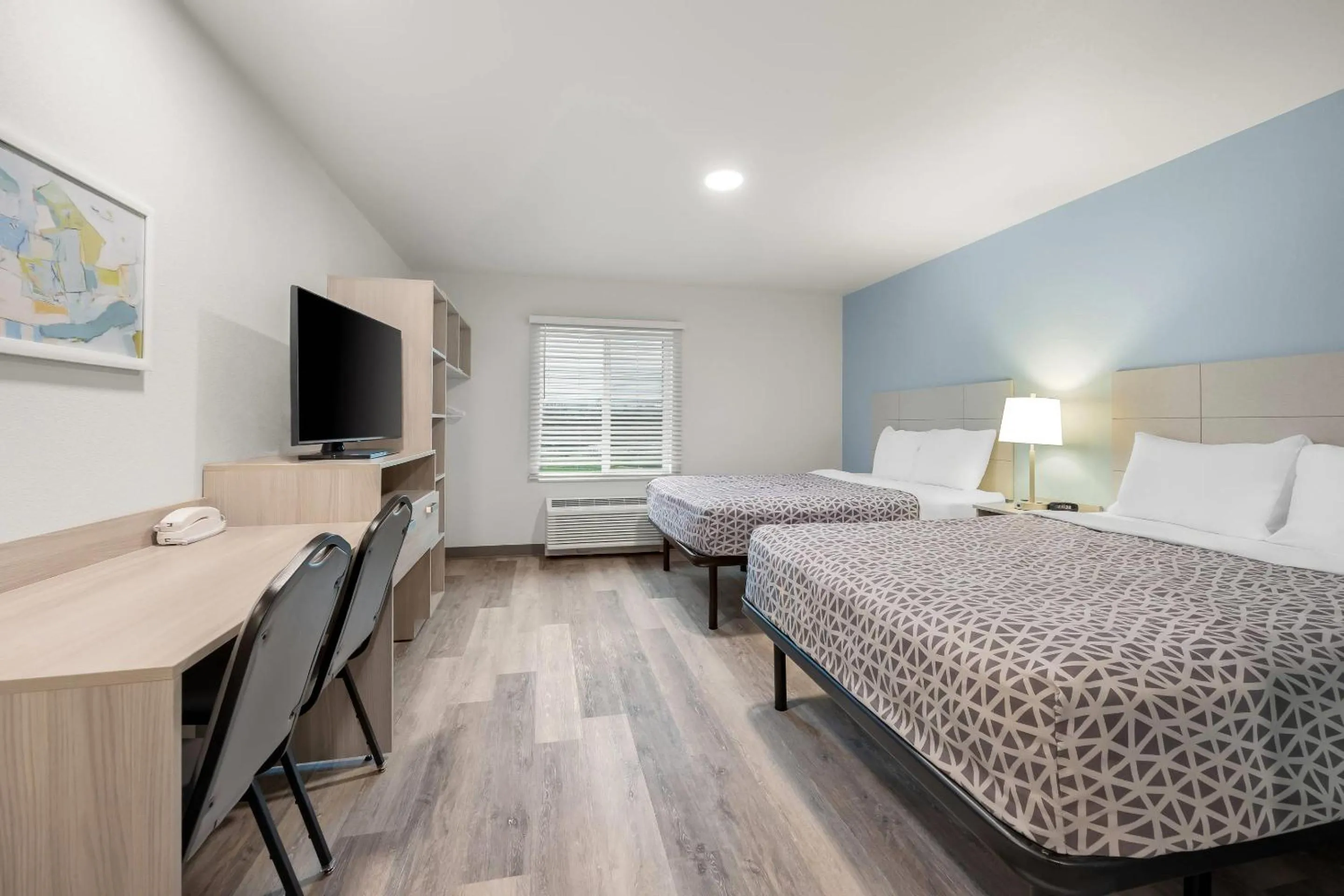 Bed in WoodSpring Suites Medford near I-5