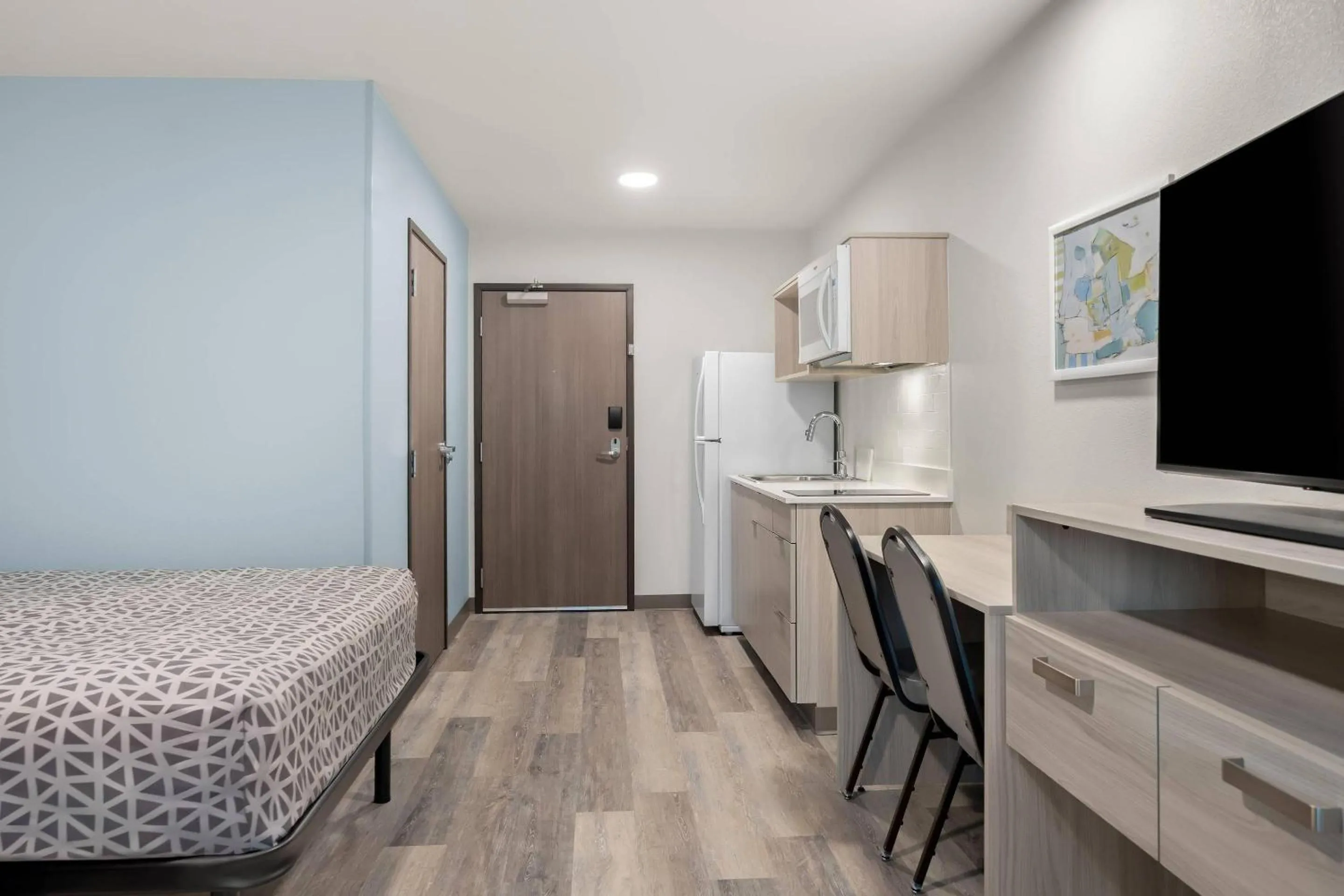 Bed in WoodSpring Suites Medford near I-5