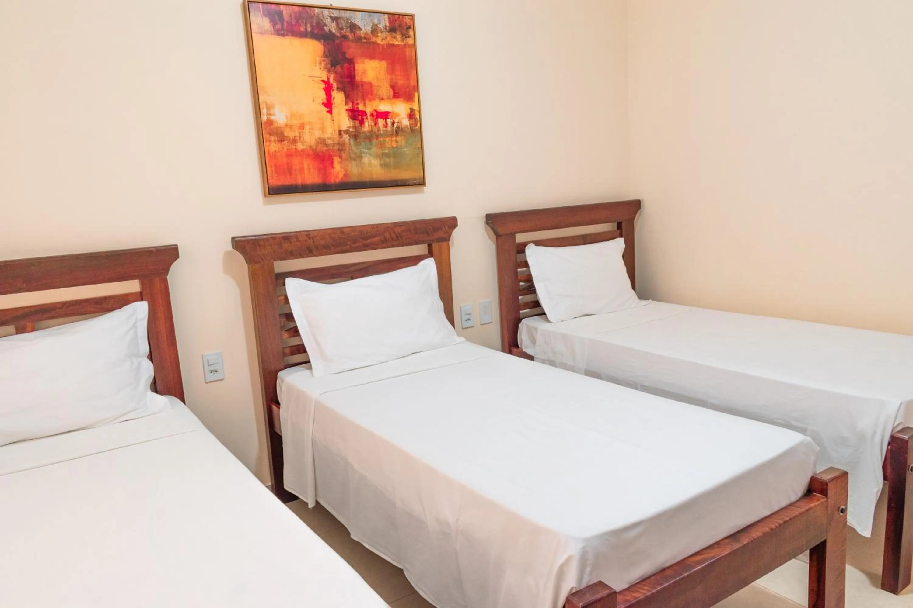 Bed in BellaMinas Pousada