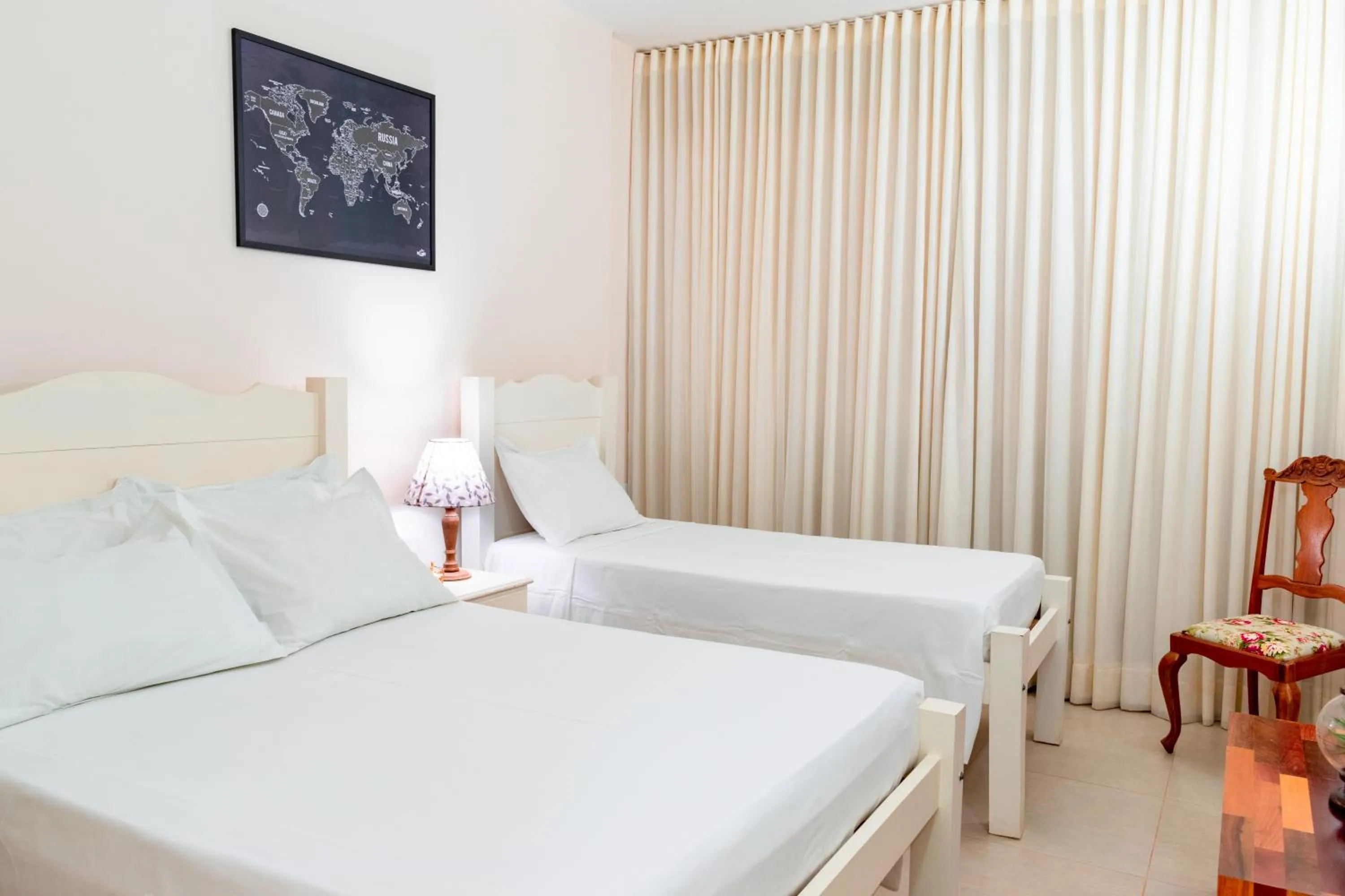 Bed in BellaMinas Pousada