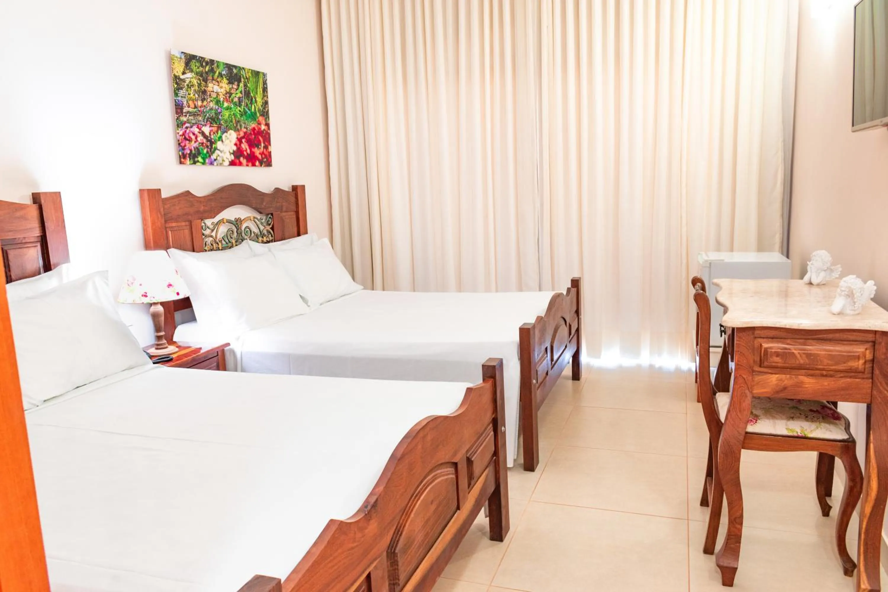 Bed in BellaMinas Pousada