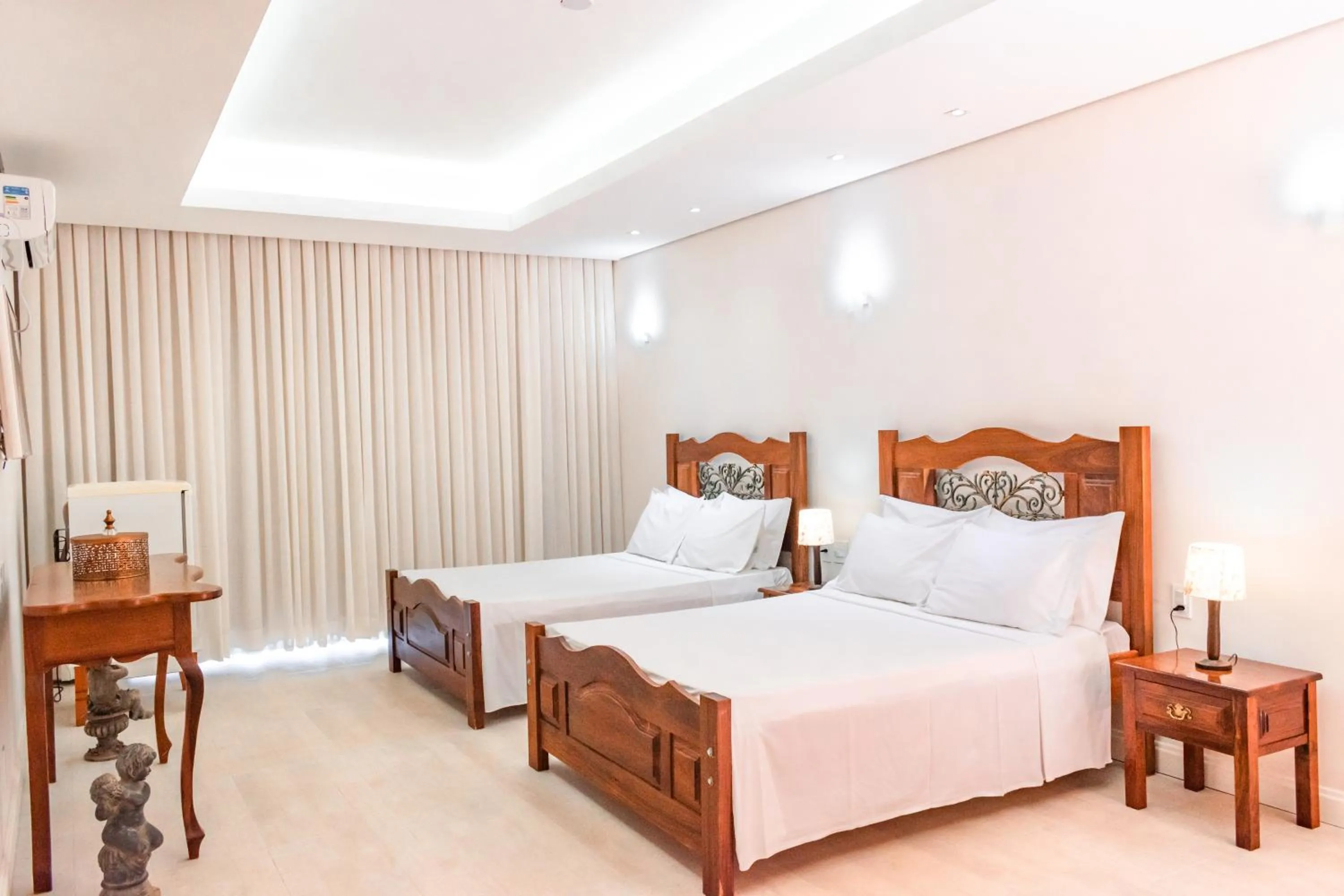 Bed in BellaMinas Pousada