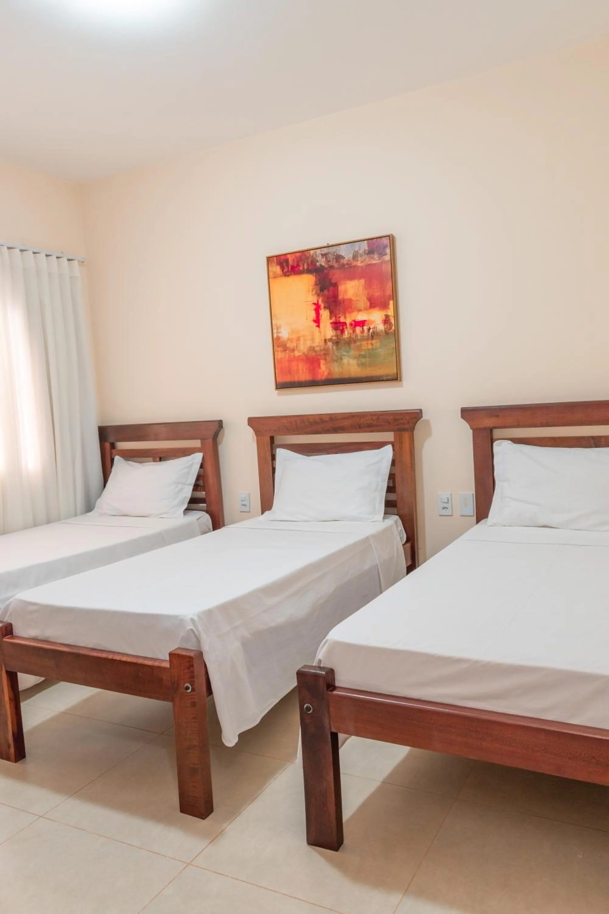 Bed in BellaMinas Pousada