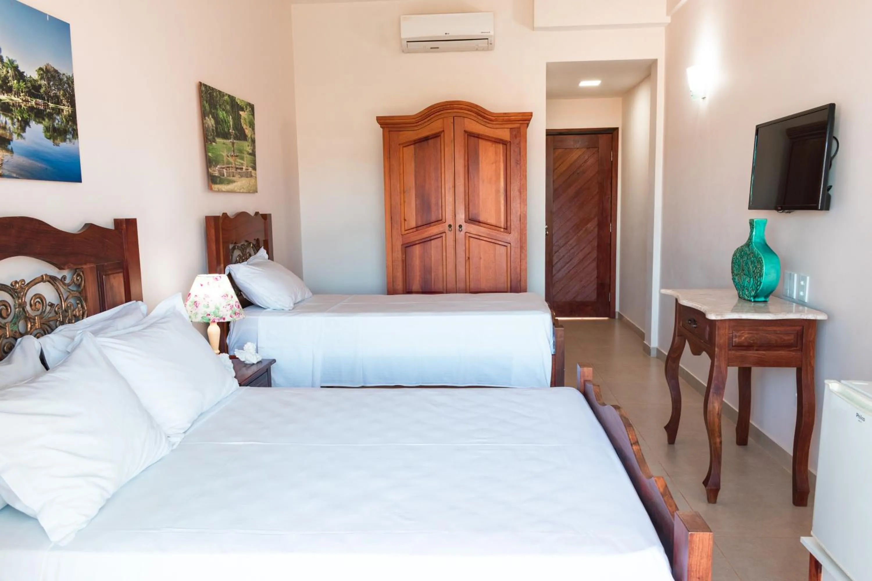 Bed in BellaMinas Pousada