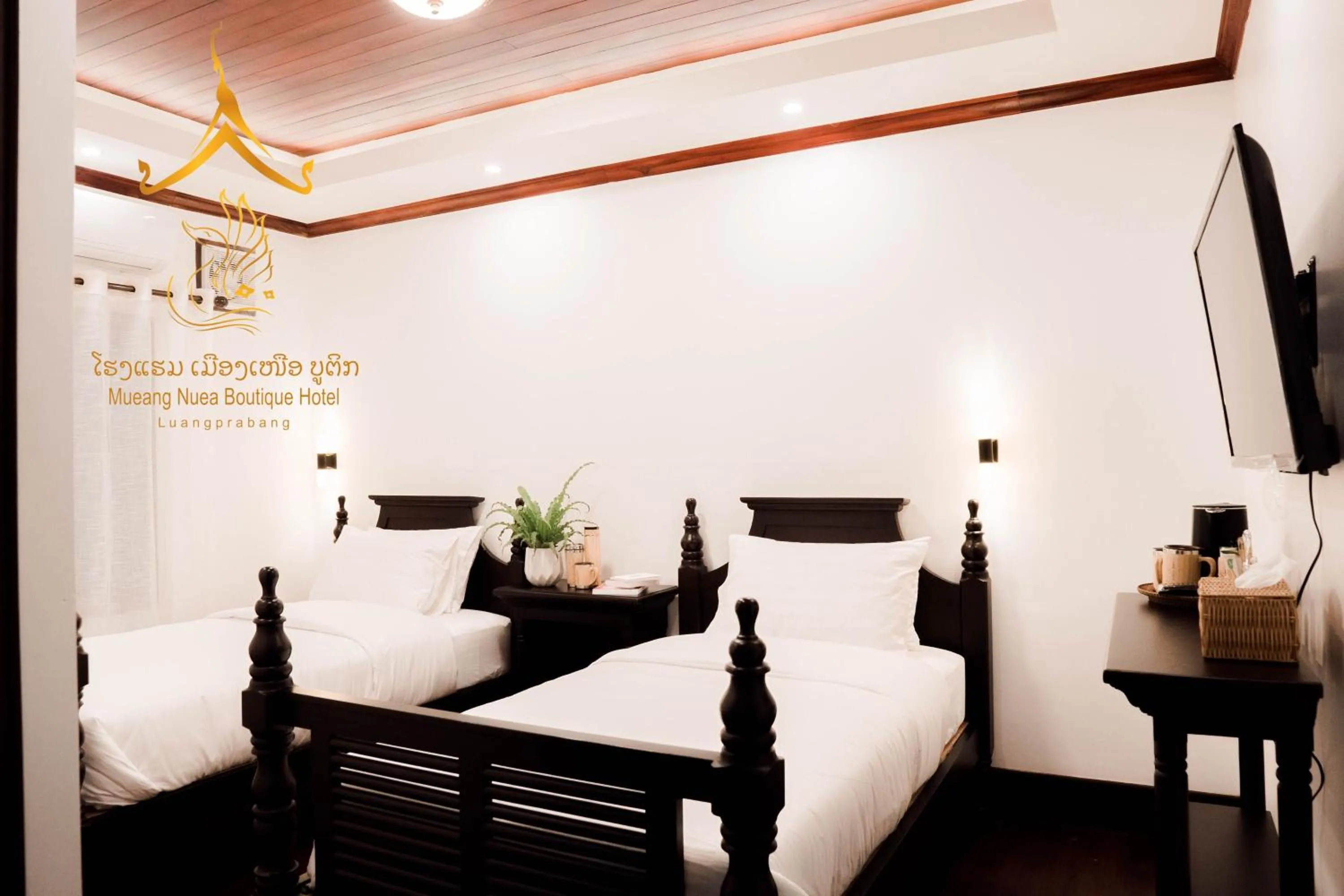Bed in Mueang Nuea Boutique Hotel
