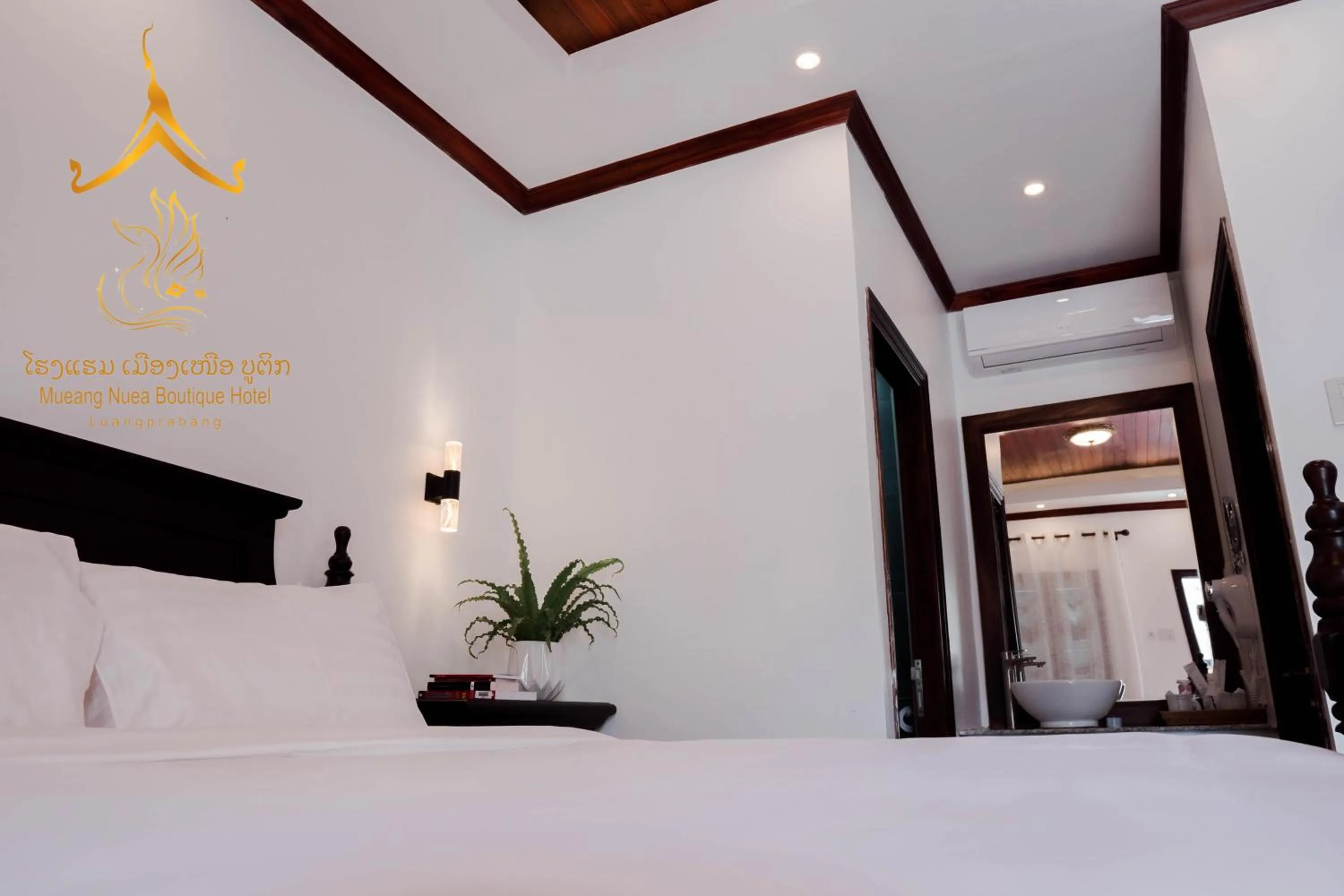 Bed in Mueang Nuea Boutique Hotel