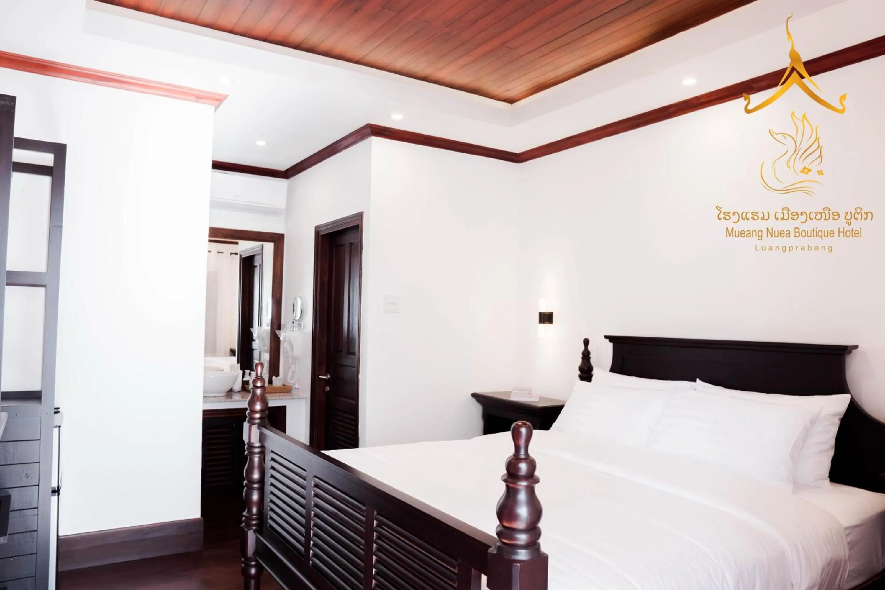 Bed in Mueang Nuea Boutique Hotel