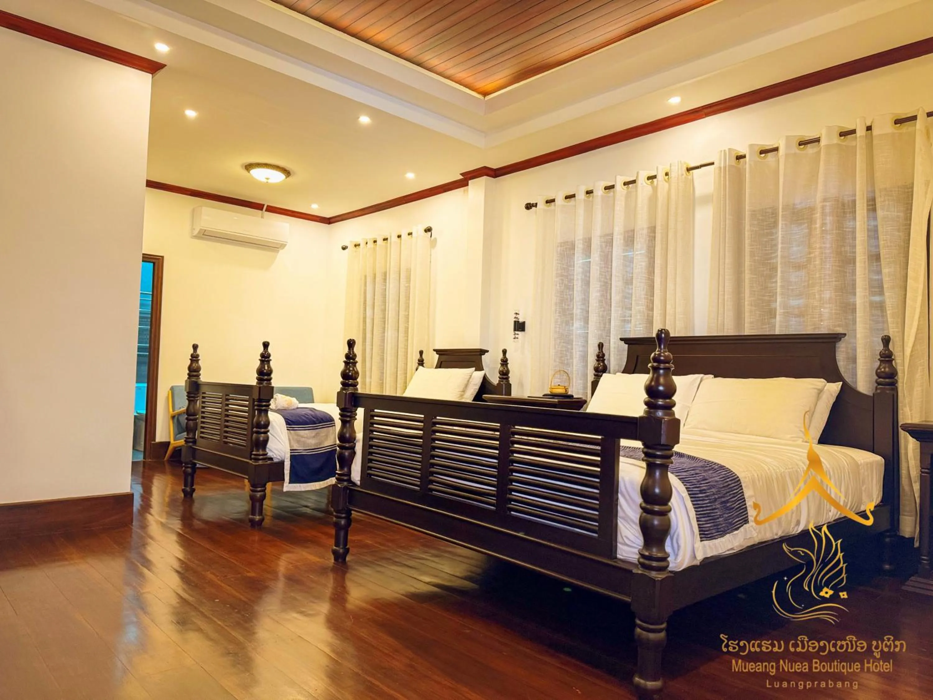 Bed in Mueang Nuea Boutique Hotel