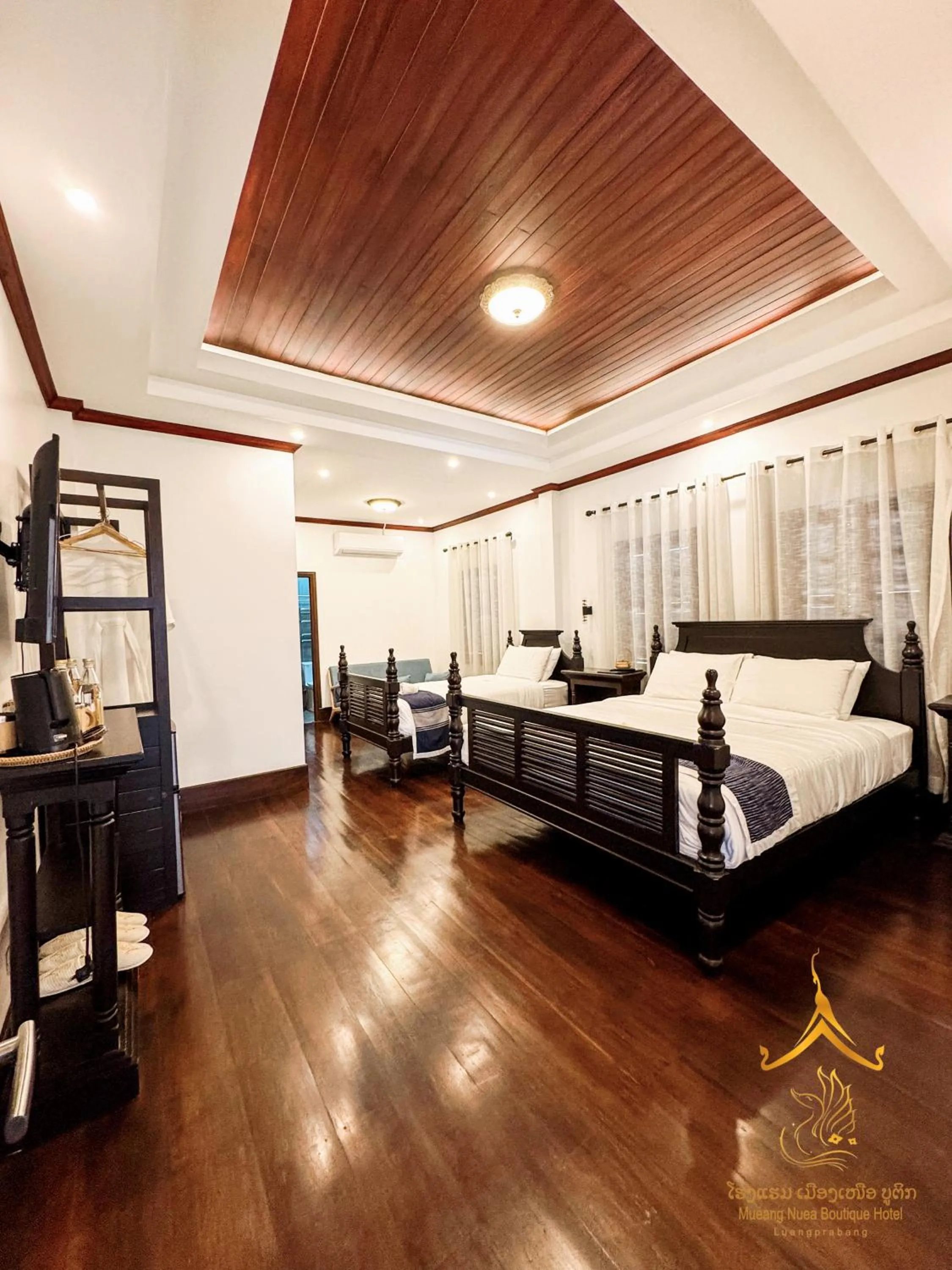 Photo of the whole room, Bed in Mueang Nuea Boutique Hotel