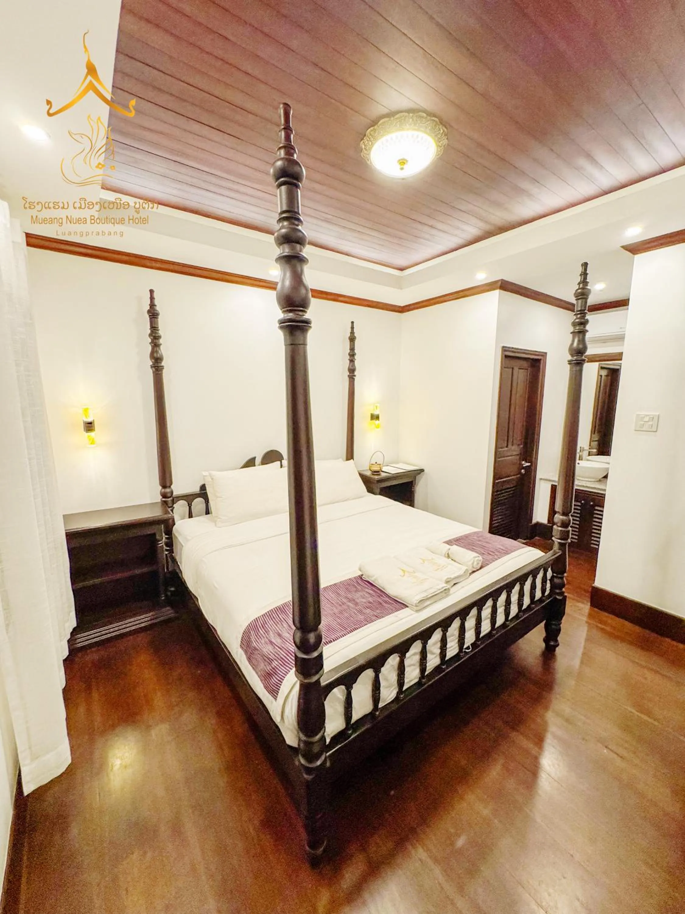 Bed in Mueang Nuea Boutique Hotel