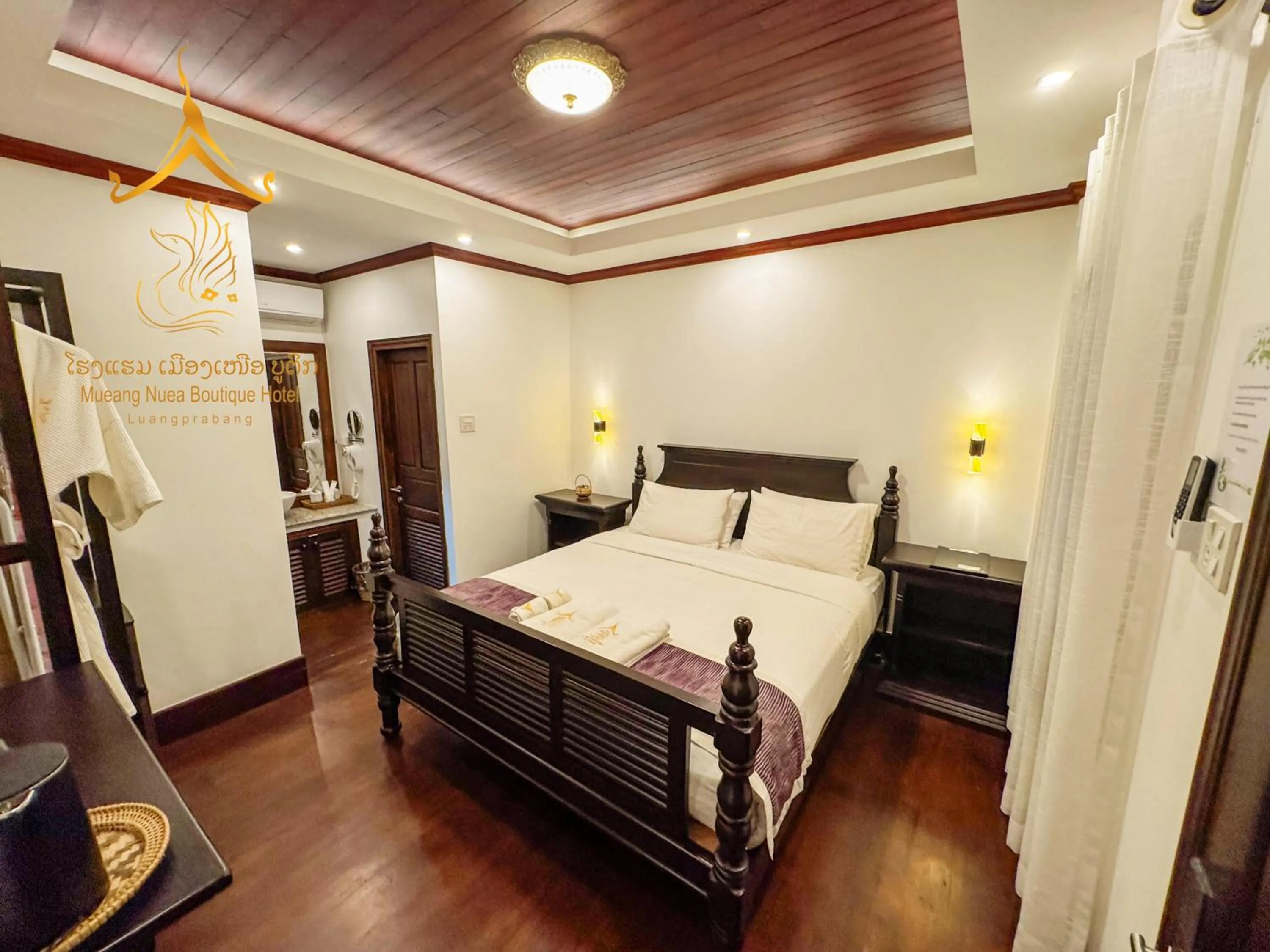 Photo of the whole room, Bed in Mueang Nuea Boutique Hotel