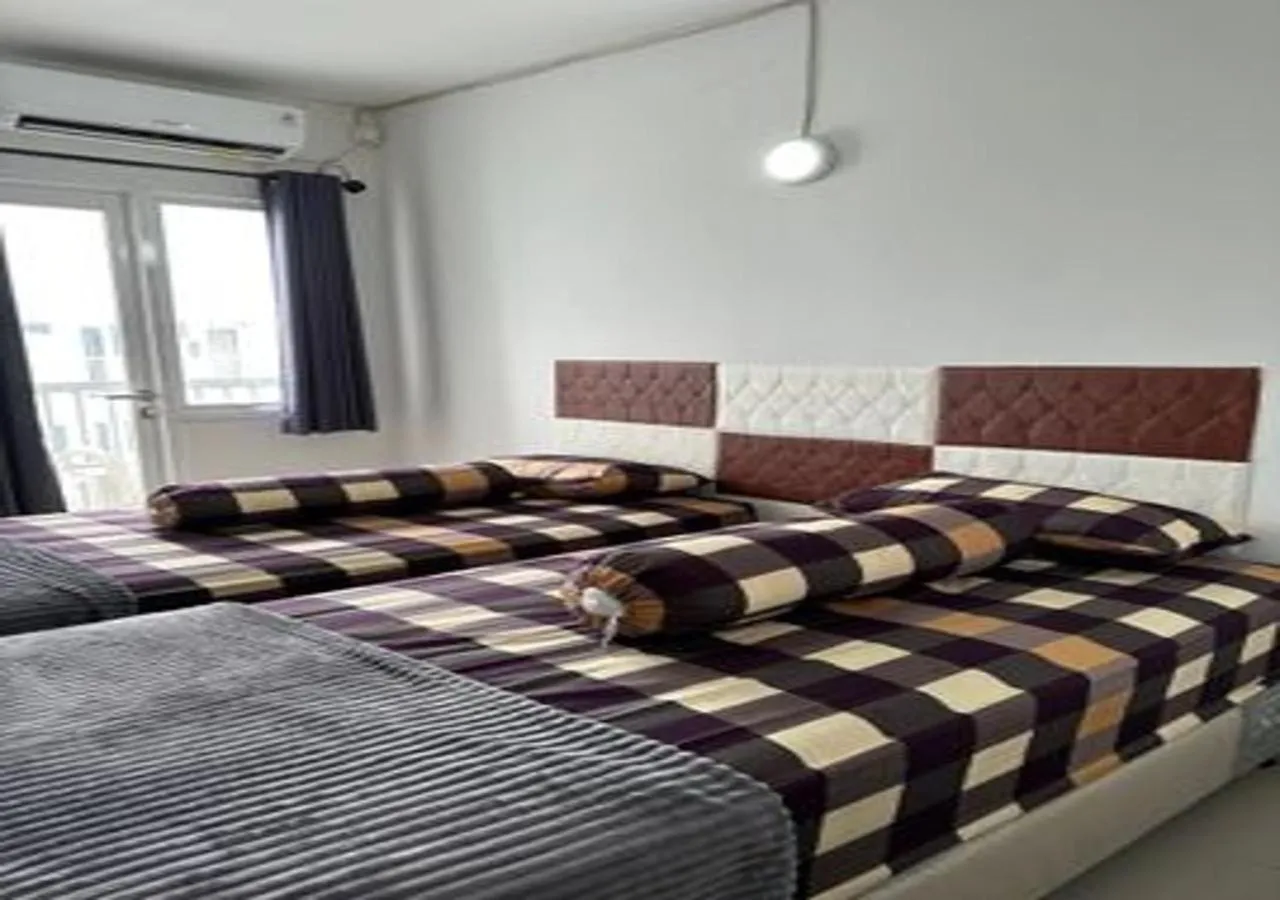 Bed in Laguna Room at Apartment Grand Sentraland Karawang