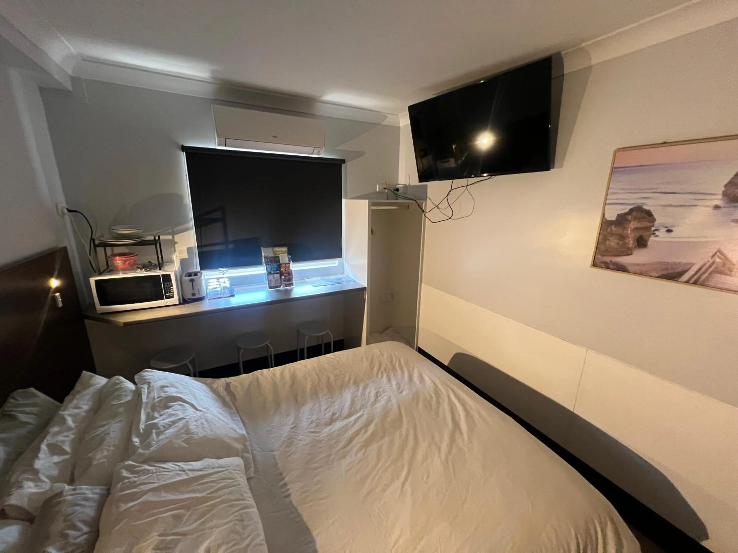 Bed in Value Inn Arafura Stairway