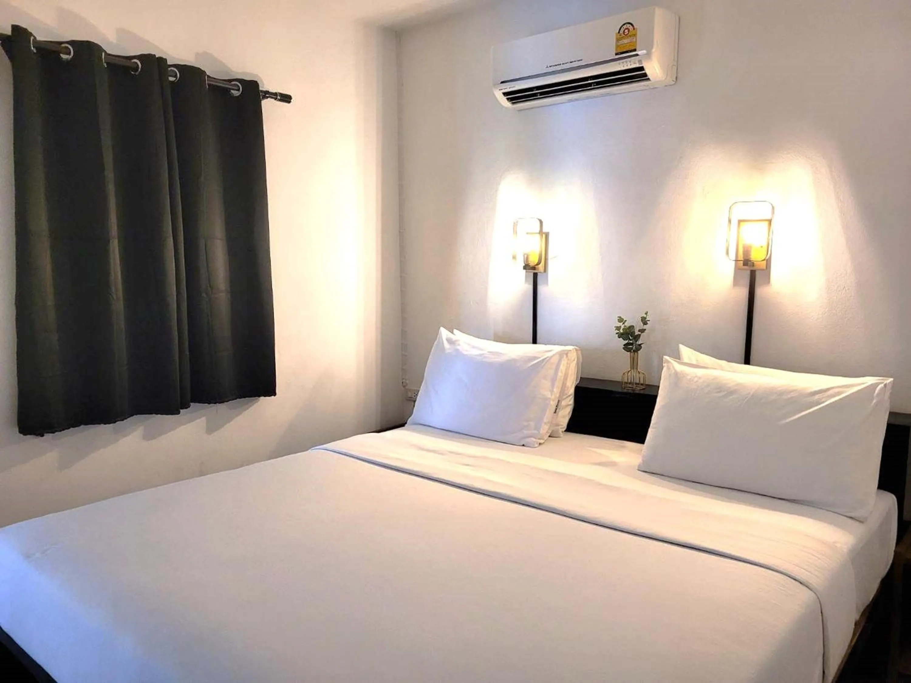 Bed in Rabbit Mansion Patong Hotel