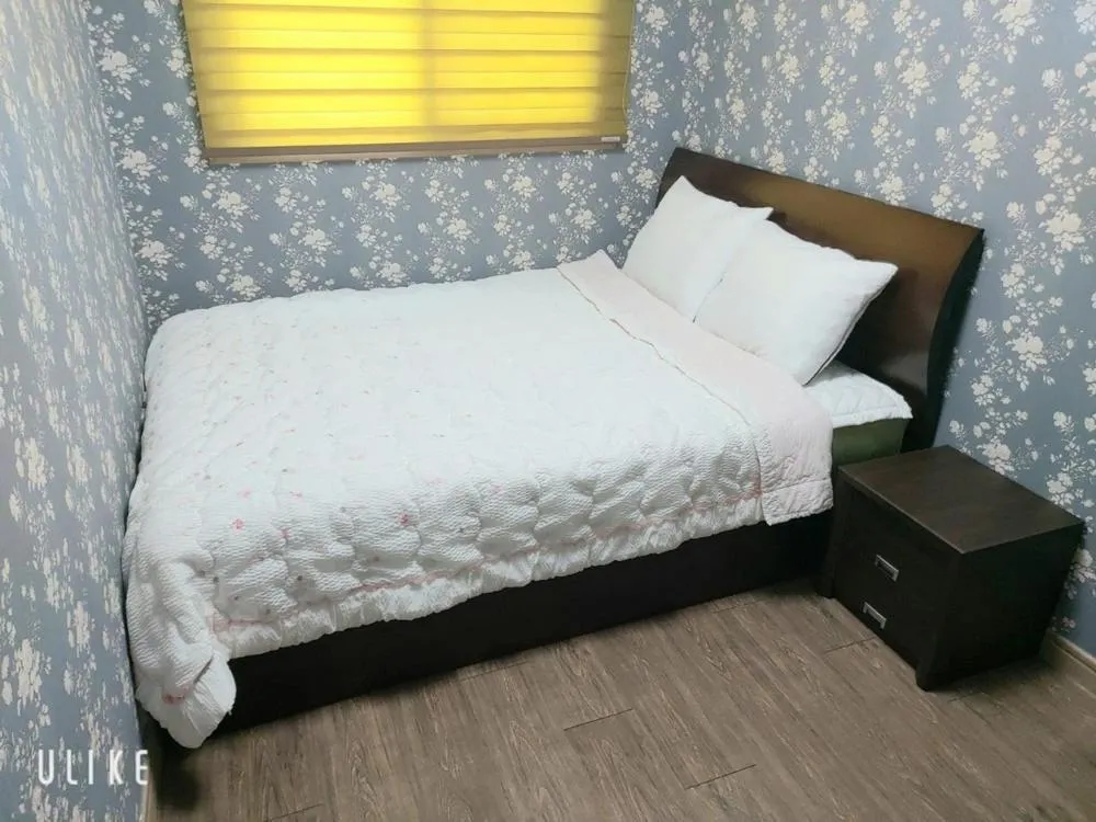 Bed in Jeju Olle House