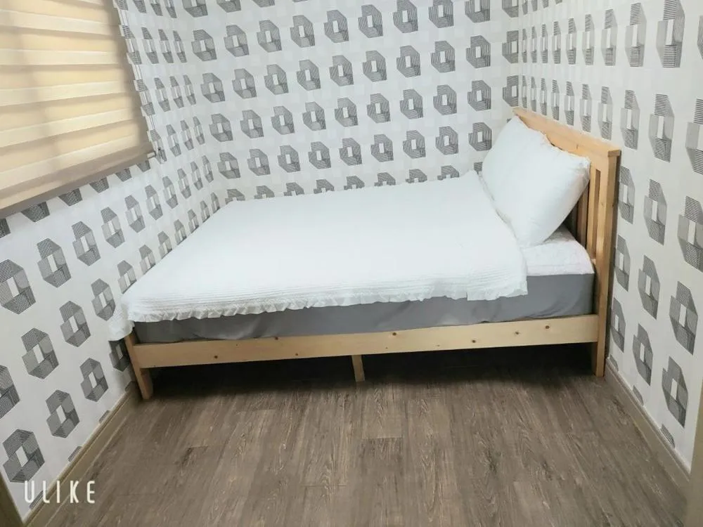 Bed in Jeju Olle House