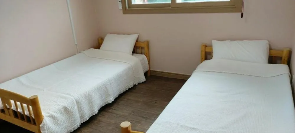 Bed in Jeju Olle House