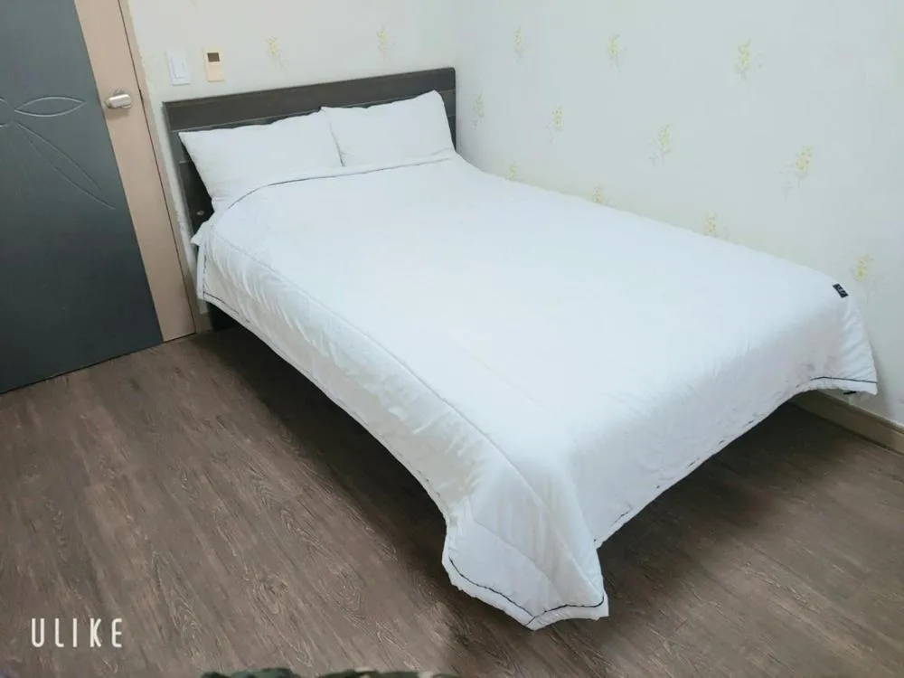 Bed in Jeju Olle House