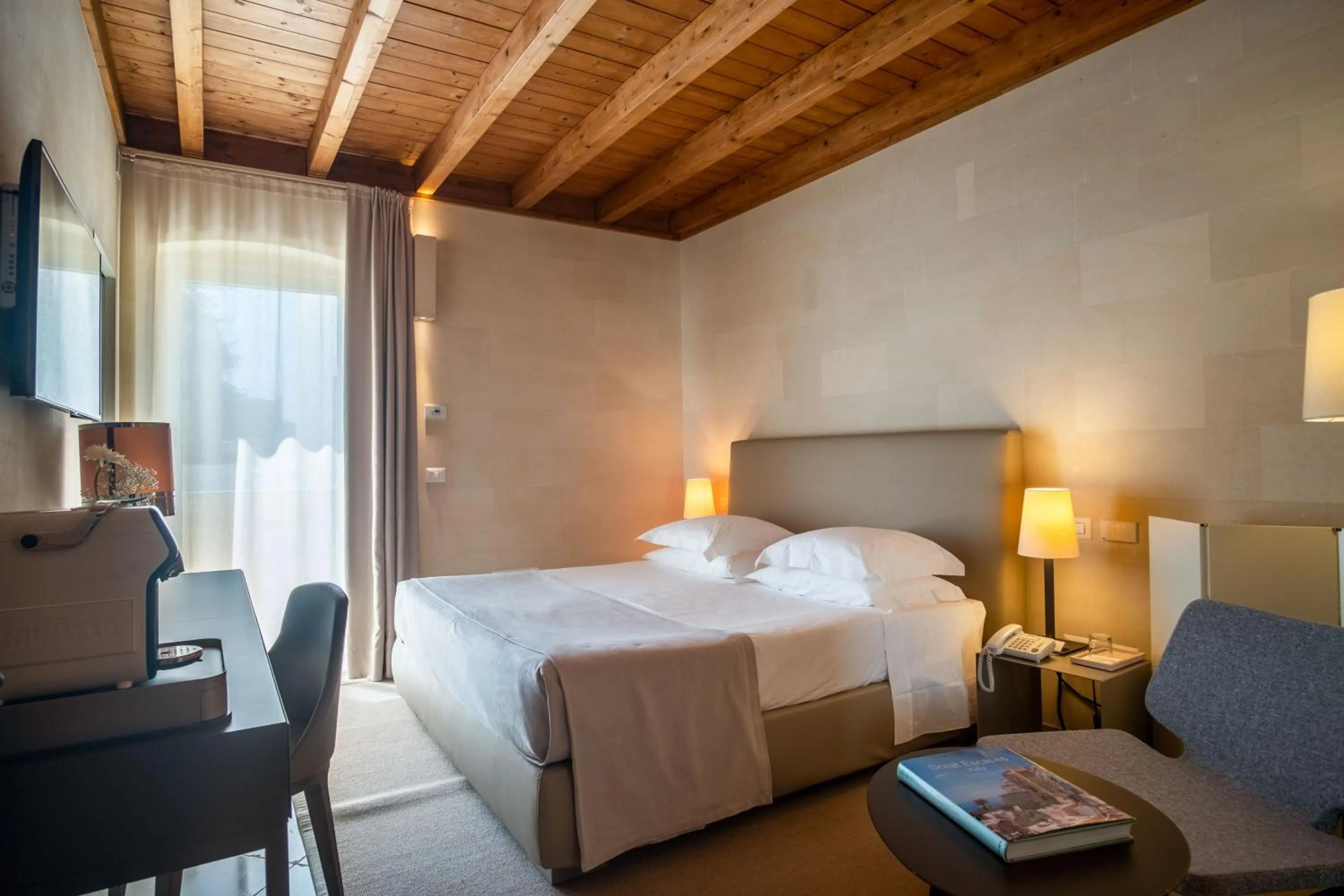 Bed in La Fiermontina Luxury Home Hotel