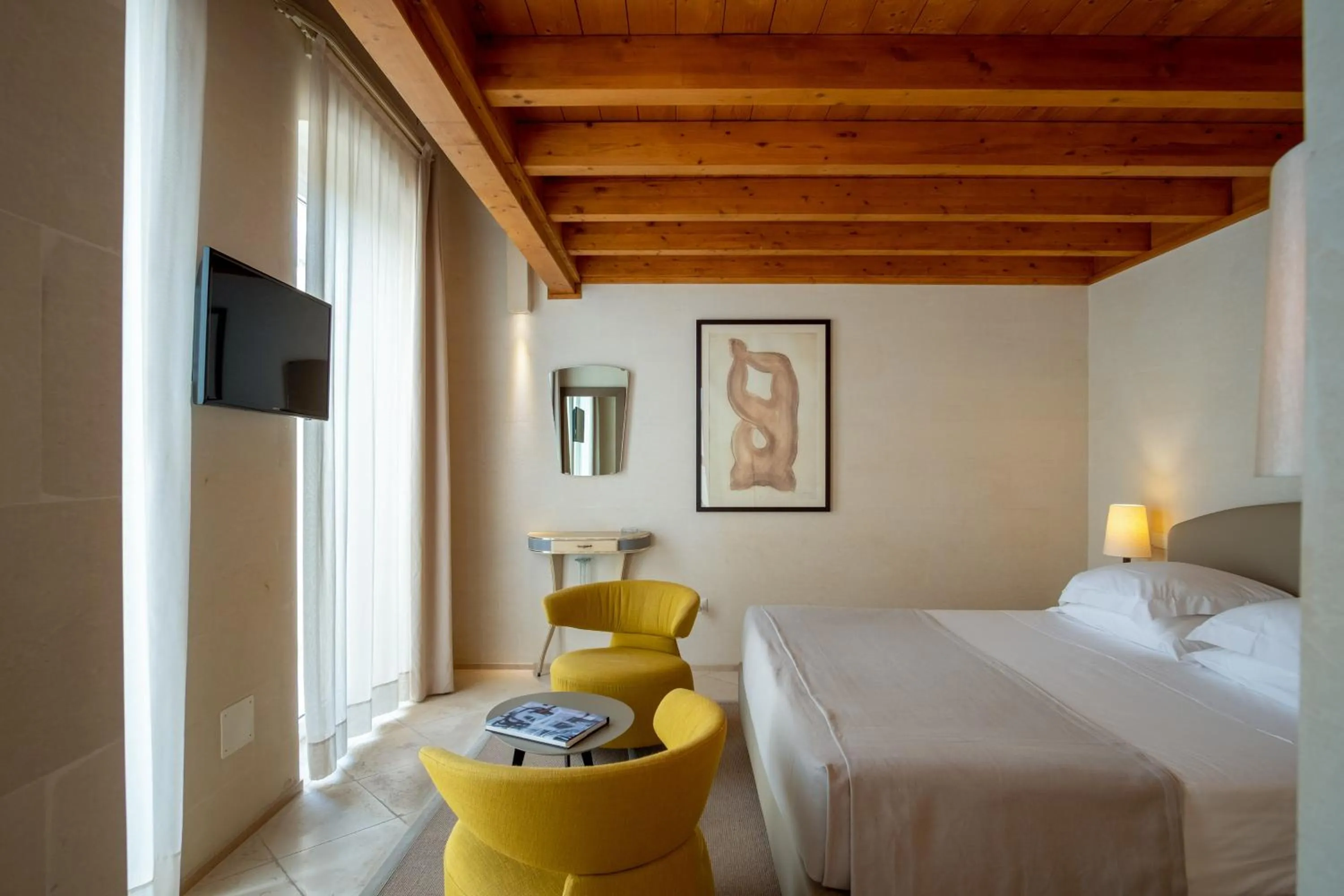 Bed in La Fiermontina Luxury Home Hotel