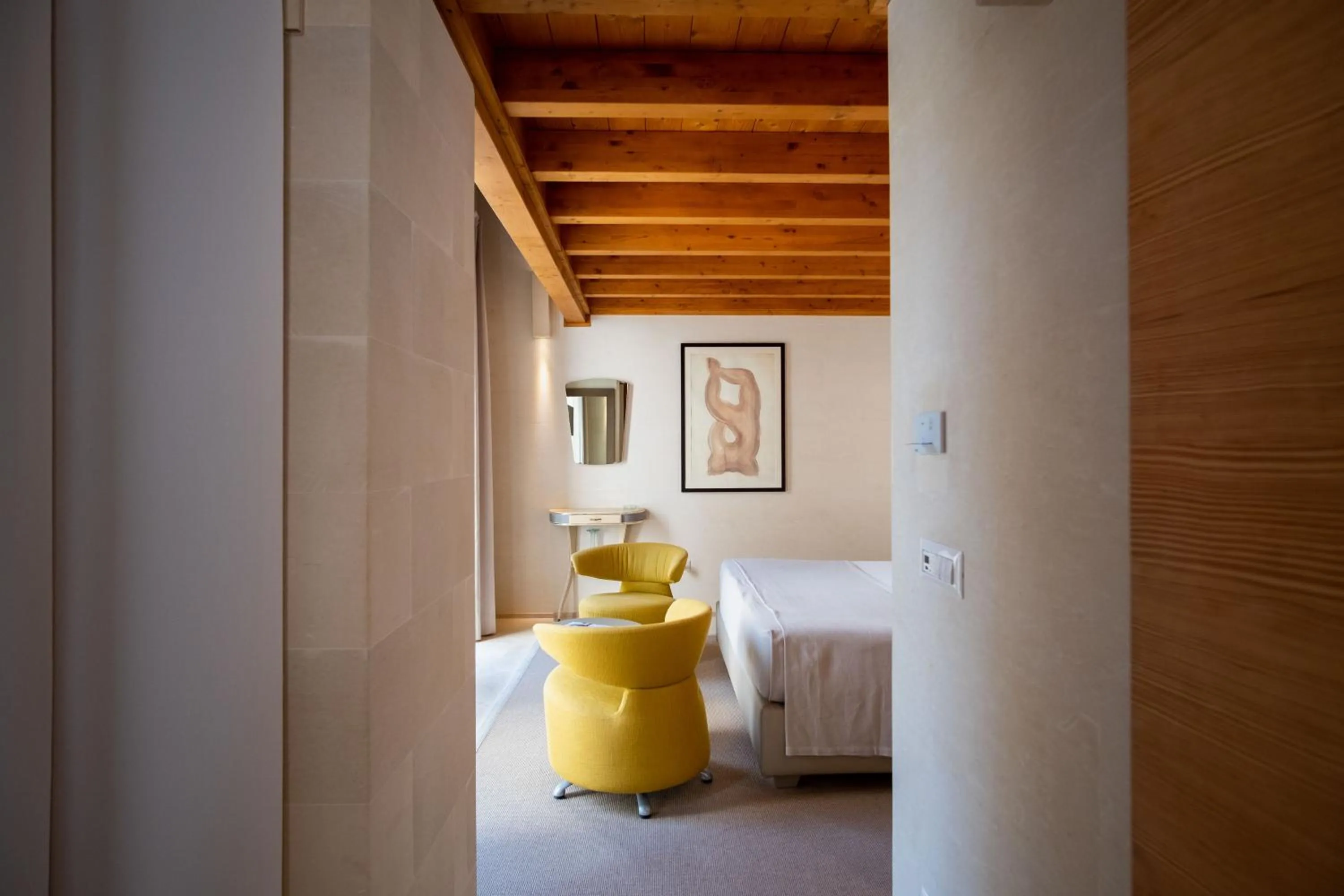 Bed in La Fiermontina Luxury Home Hotel