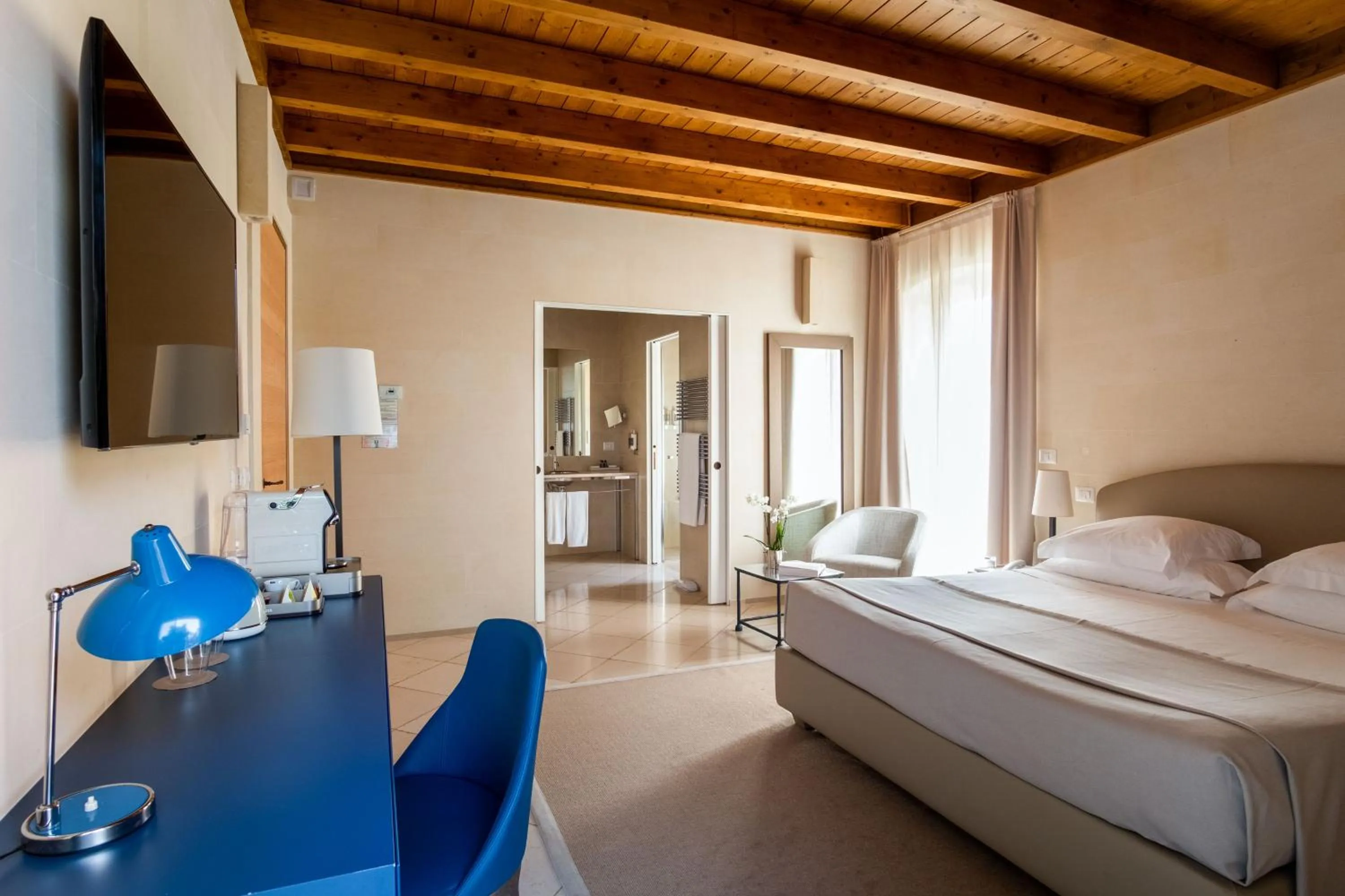 Bed in La Fiermontina Luxury Home Hotel