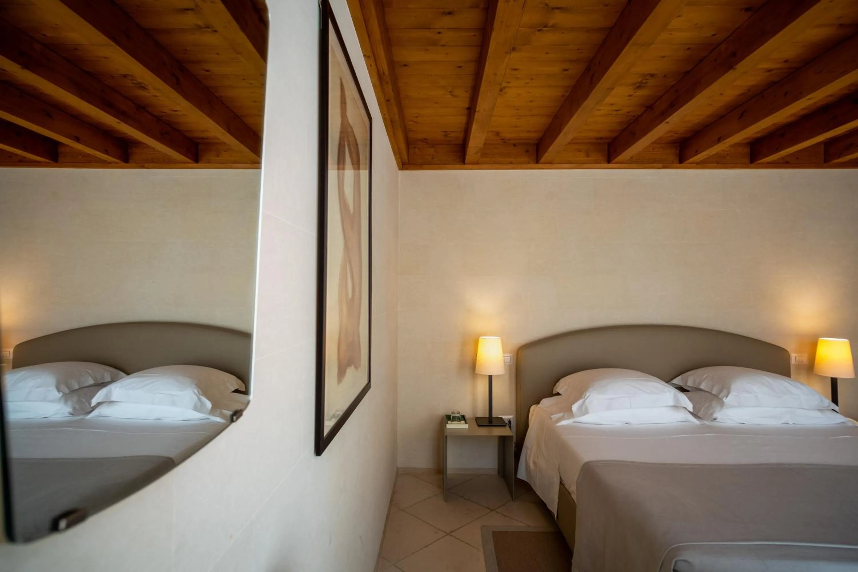 Bed in La Fiermontina Luxury Home Hotel