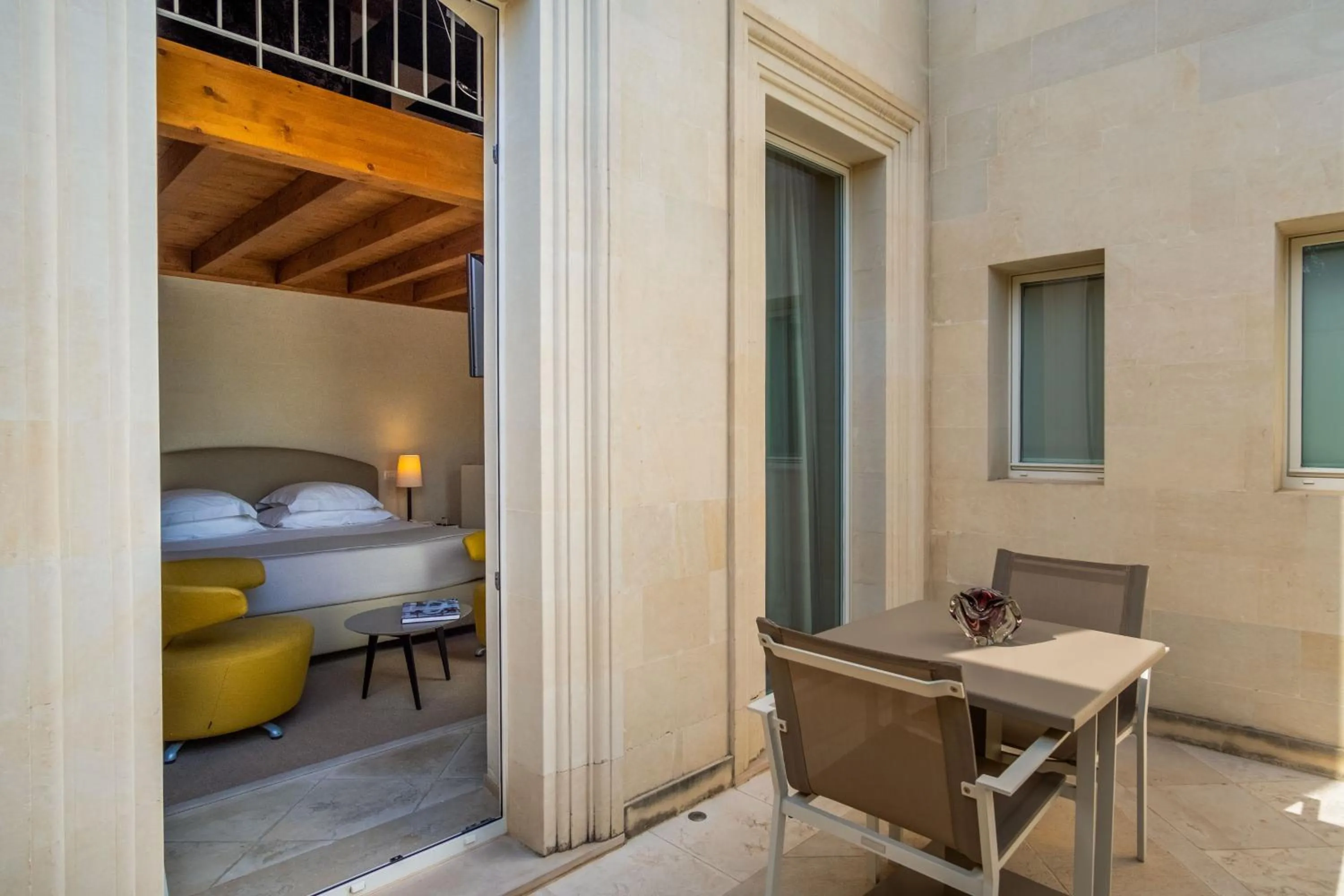 Bed in La Fiermontina Luxury Home Hotel