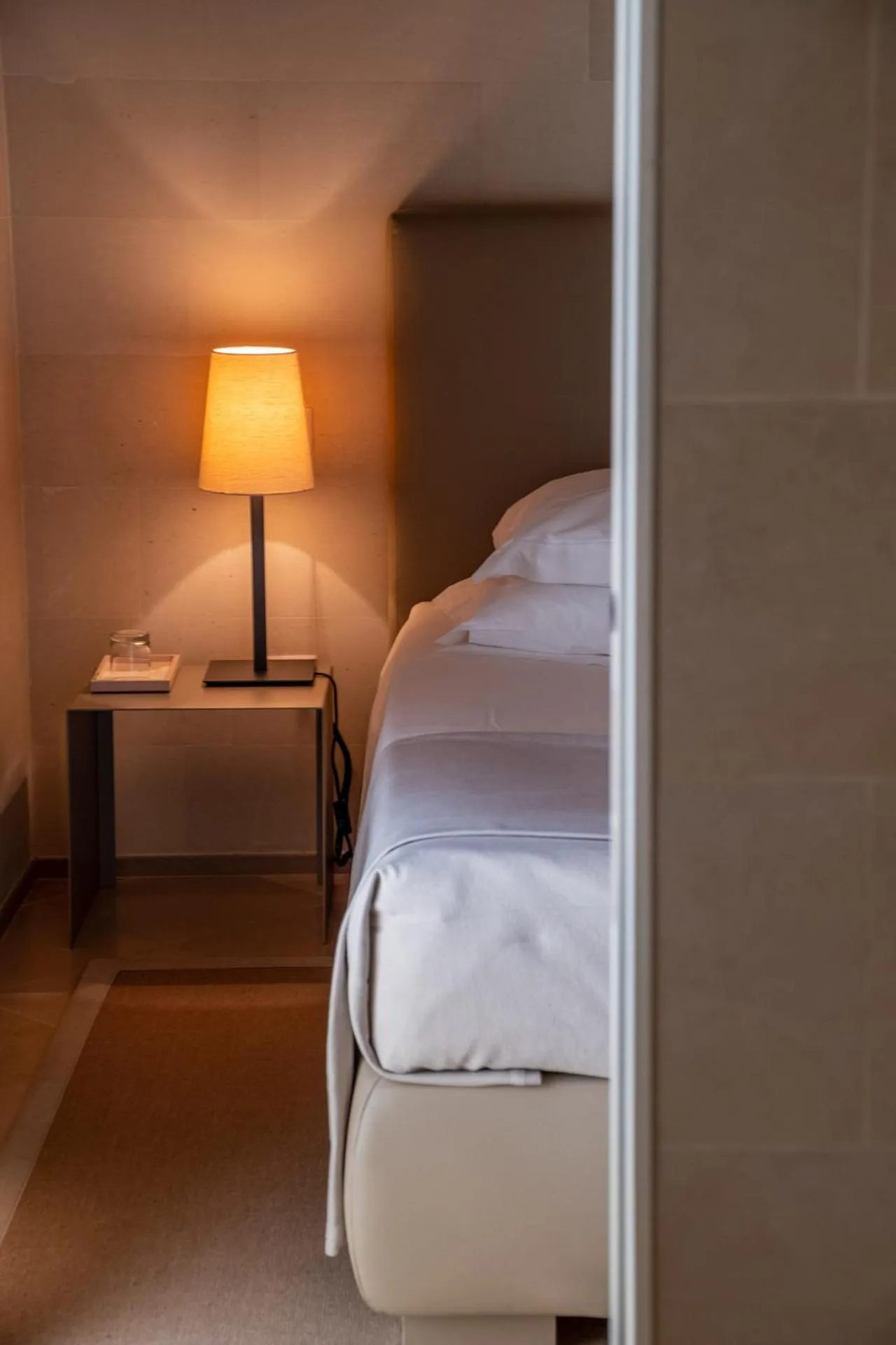 Bed in La Fiermontina Luxury Home Hotel