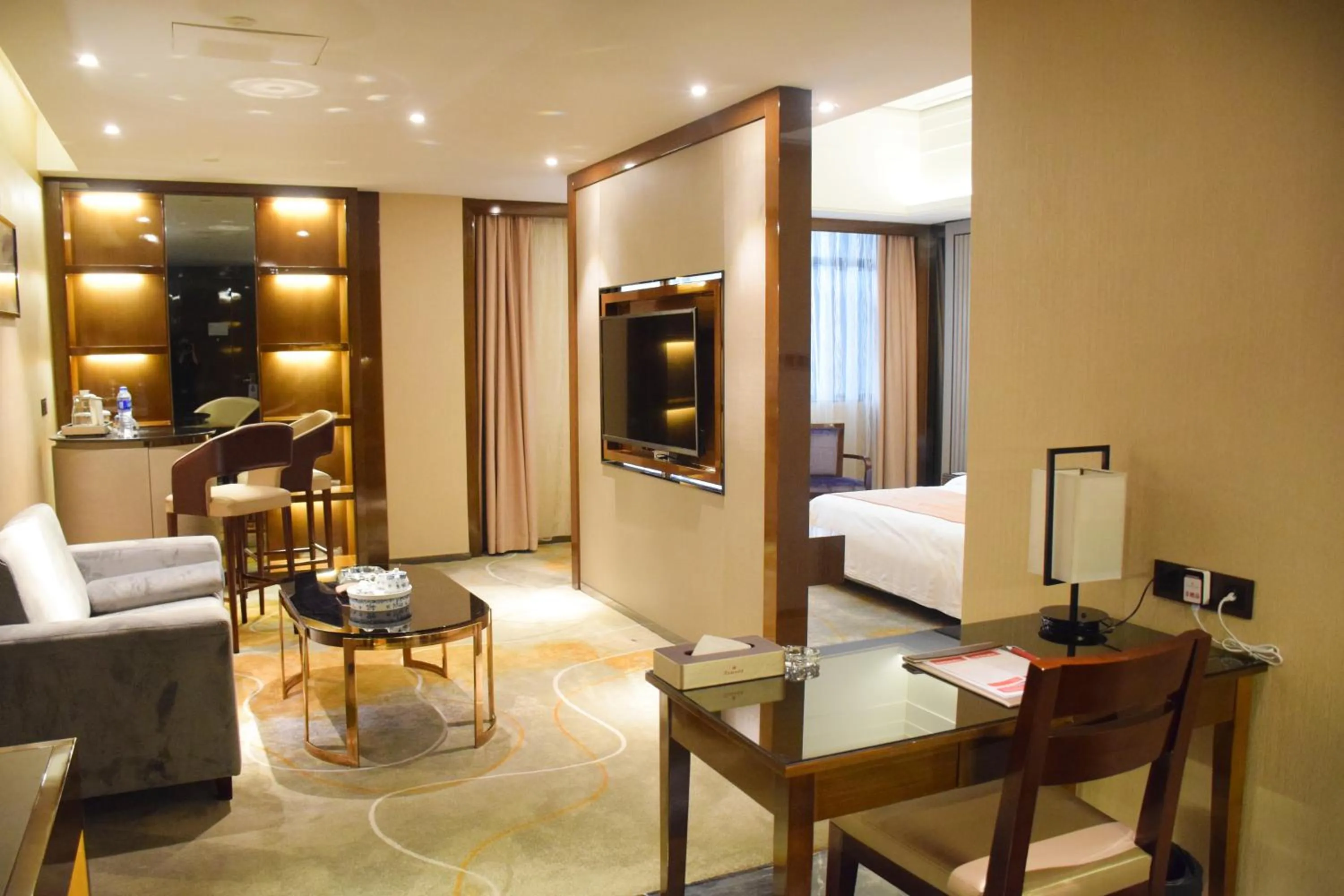 Living room, Bed in Ramada Foshan Hotel