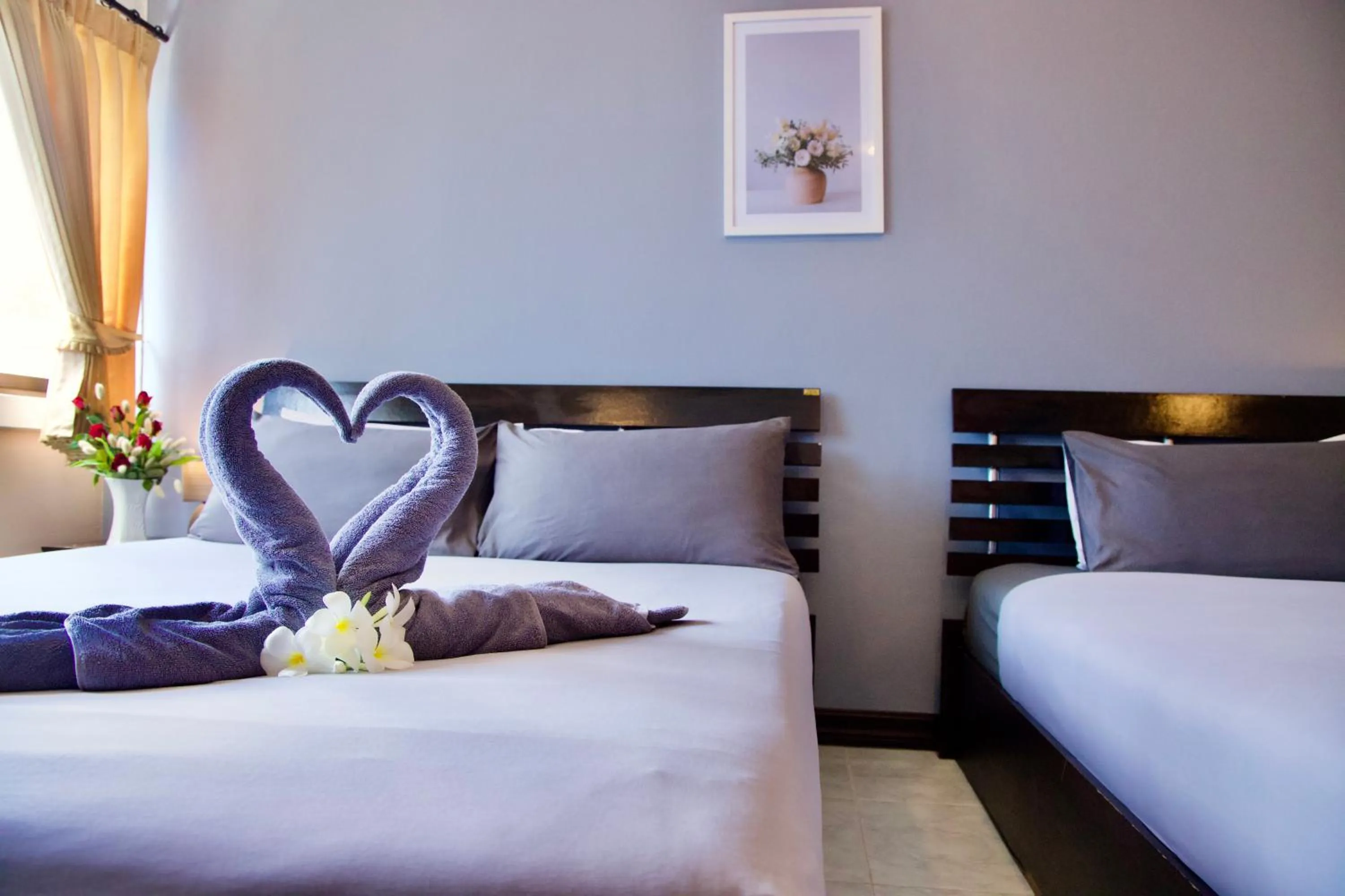 Photo of the whole room, Bed in GOLDEN GUESTHOUSE by The Beach Cha Am