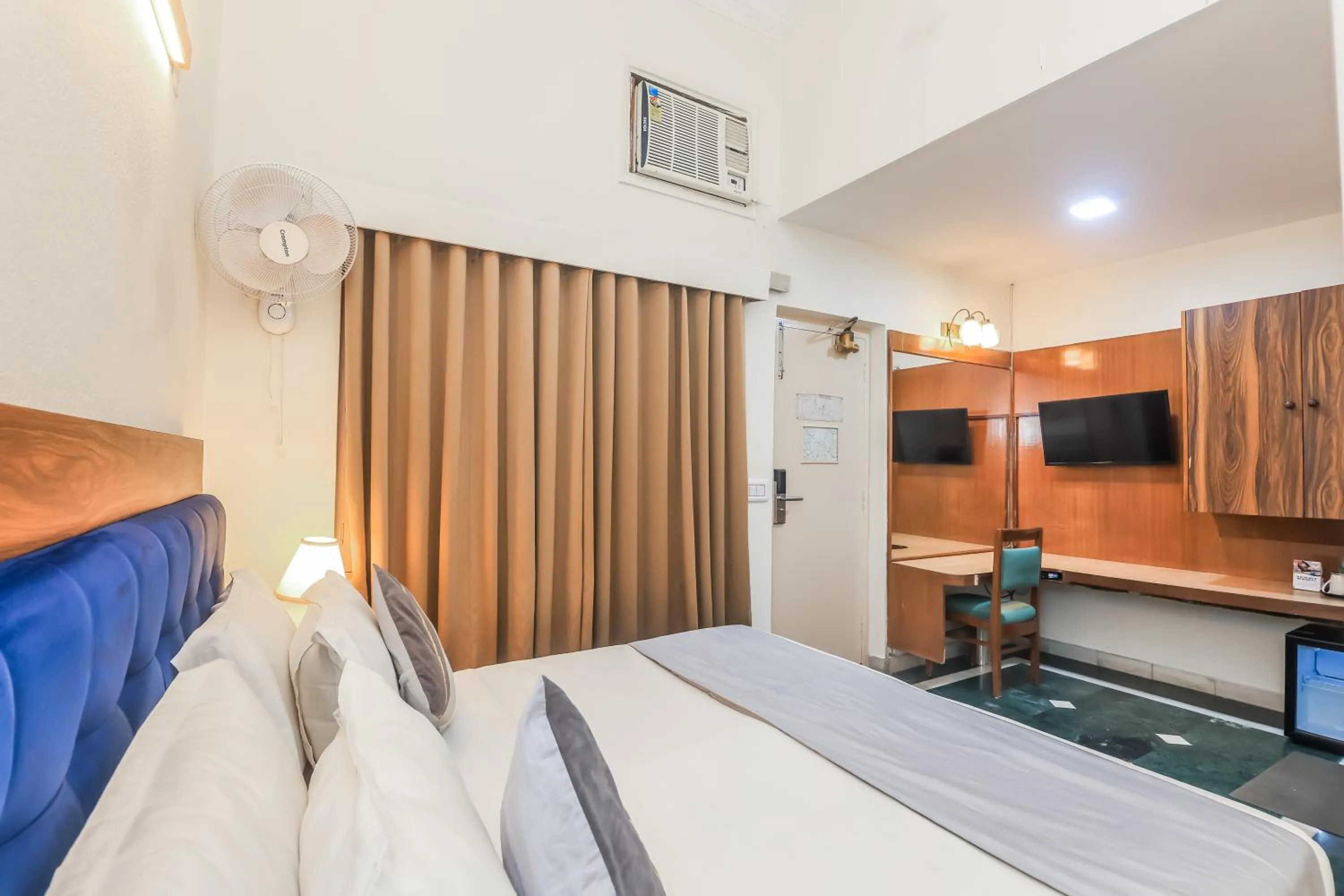 Bed in asar CP Outer Circle by Orion Hotels