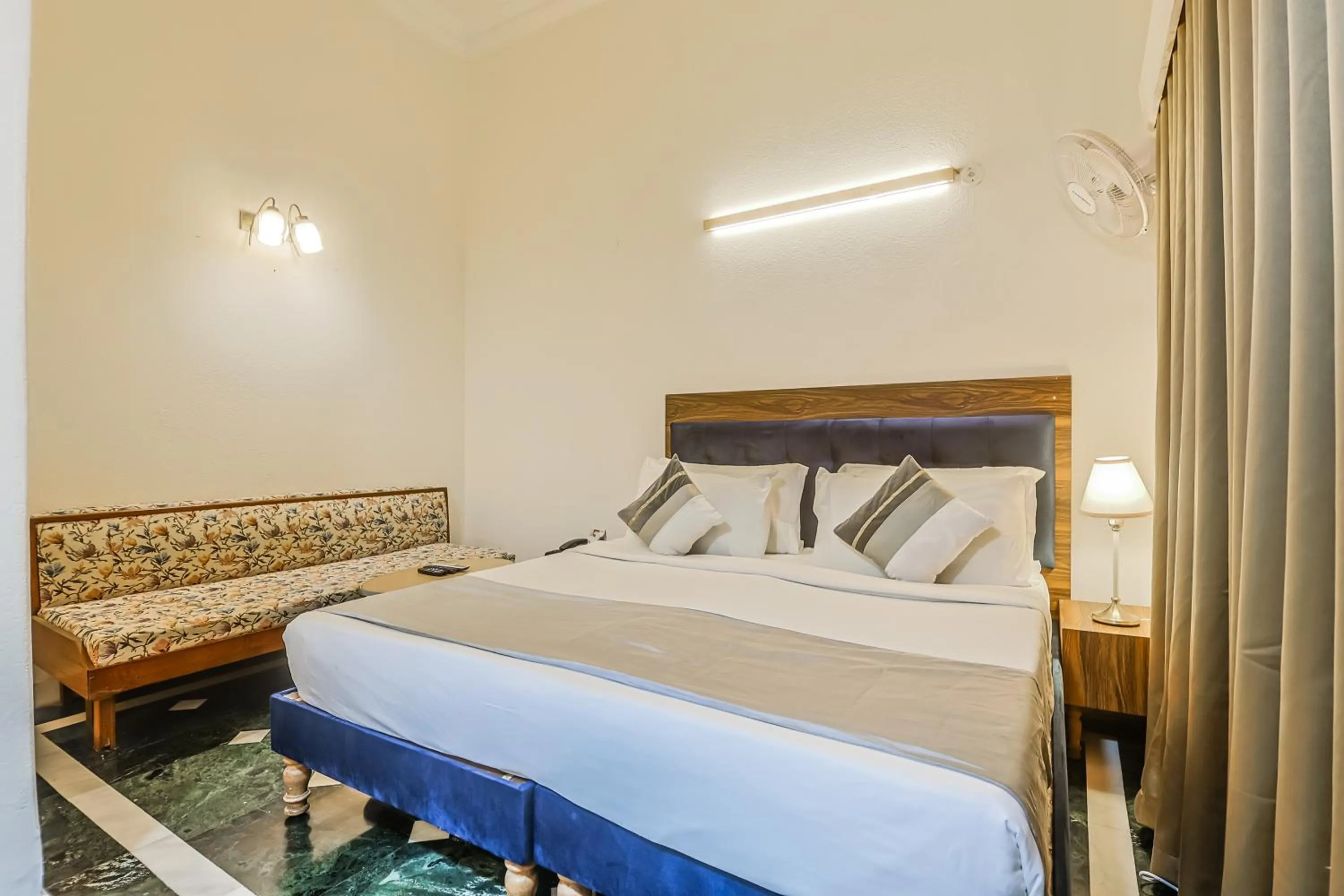 Bed in asar CP Outer Circle by Orion Hotels