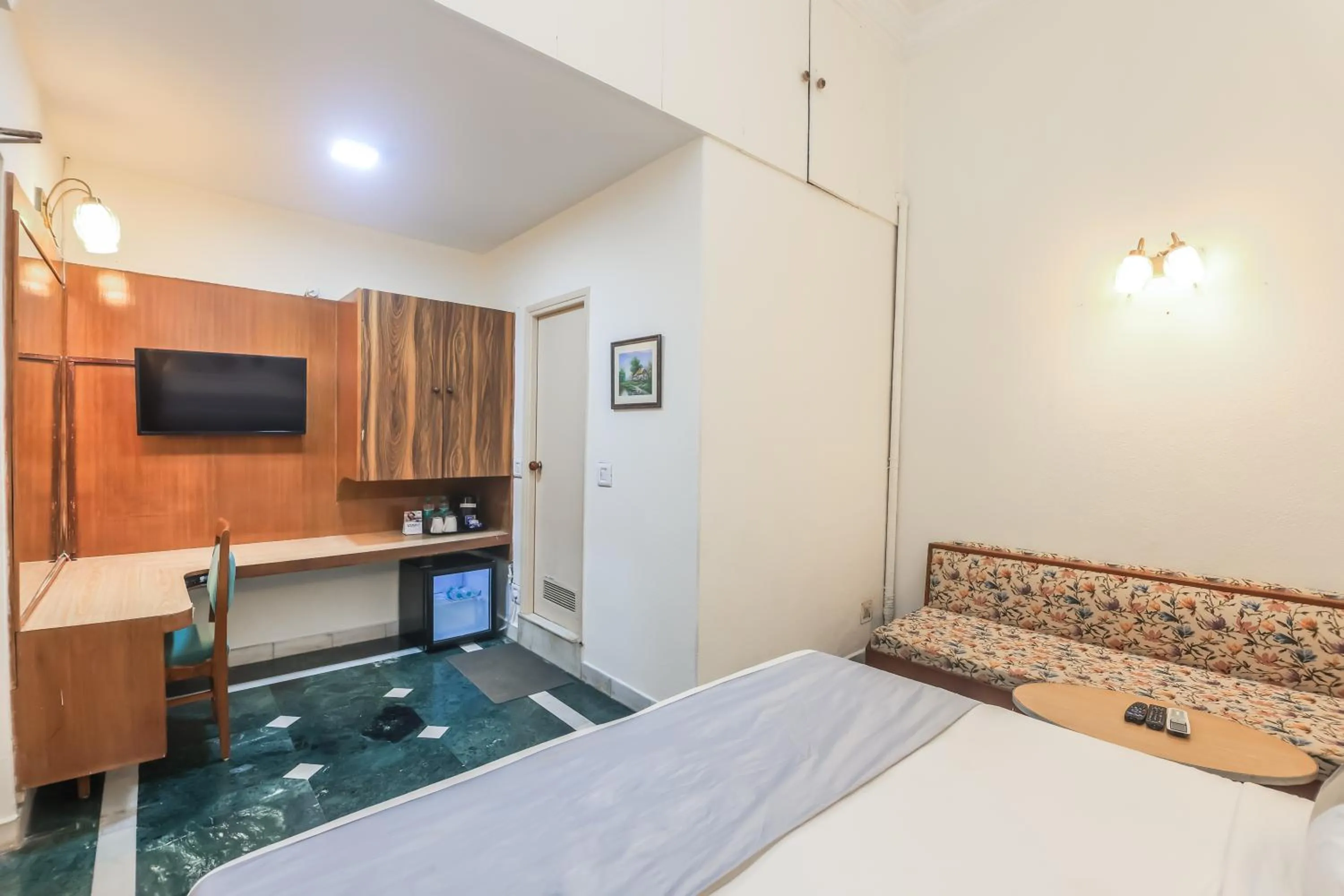 Bed in asar CP Outer Circle by Orion Hotels