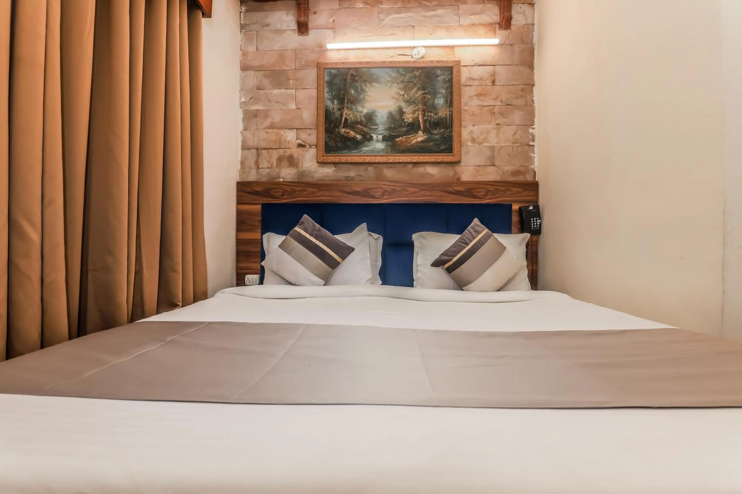 Bed in asar CP Outer Circle by Orion Hotels
