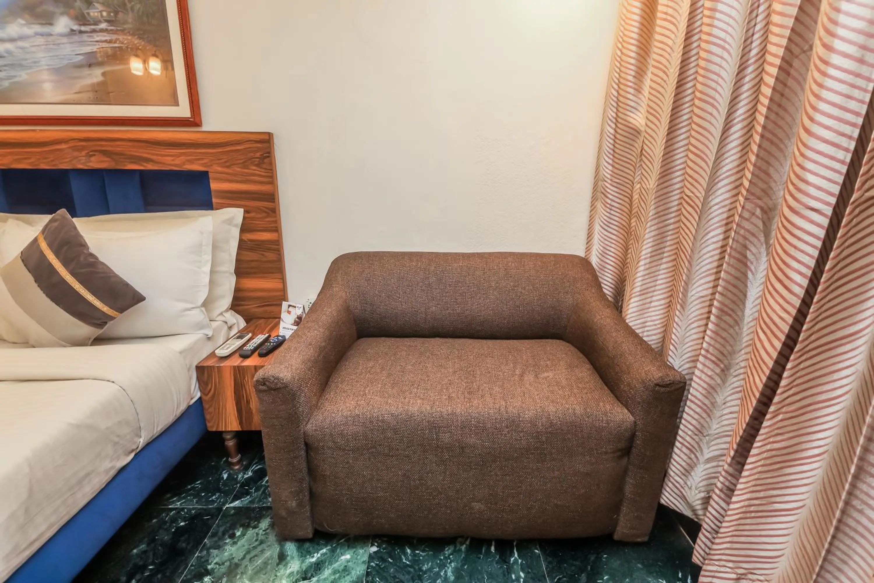Bedroom in asar CP Outer Circle by Orion Hotels