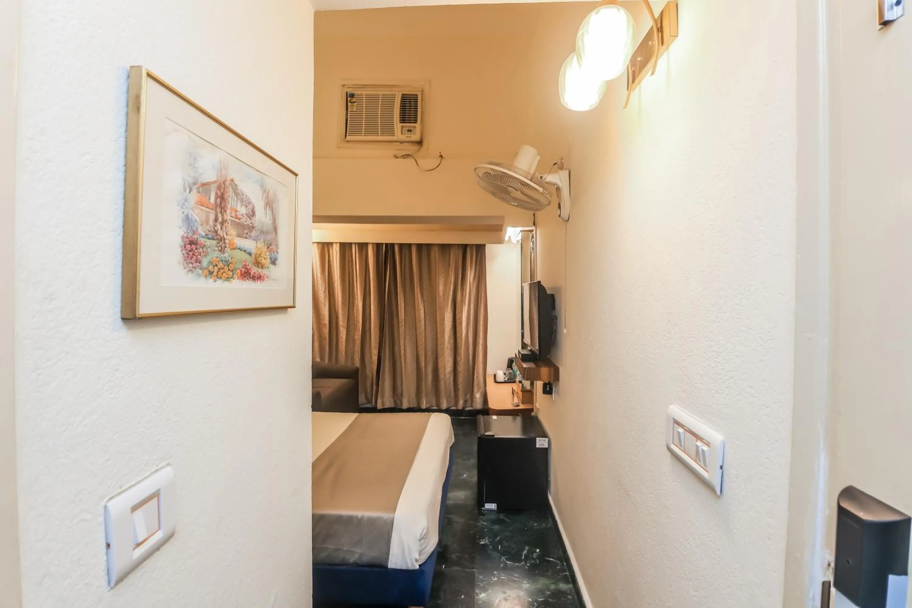 Bed in asar CP Outer Circle by Orion Hotels