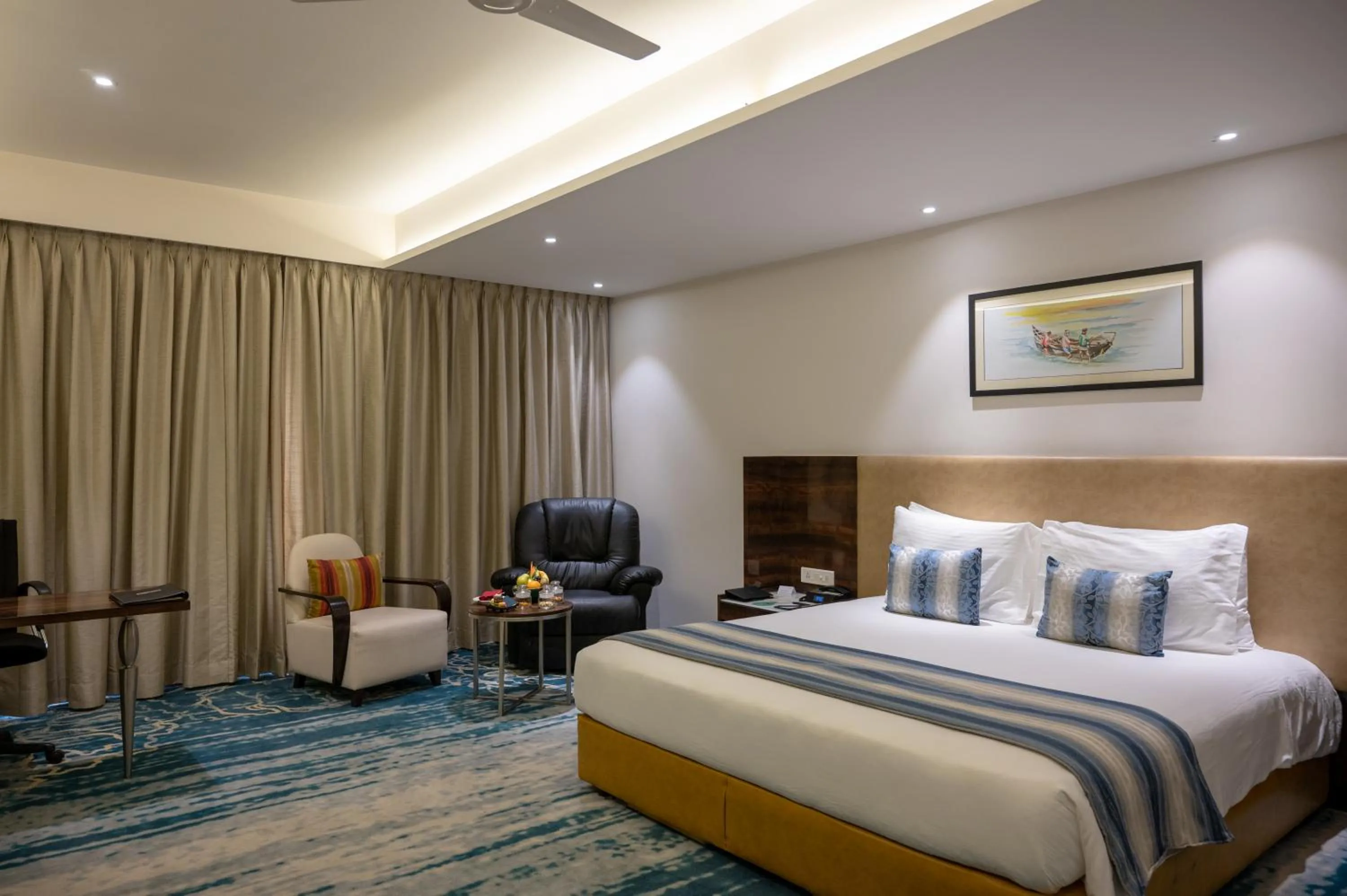 Photo of the whole room, Bed in Grand Kakinada by GRT Hotels