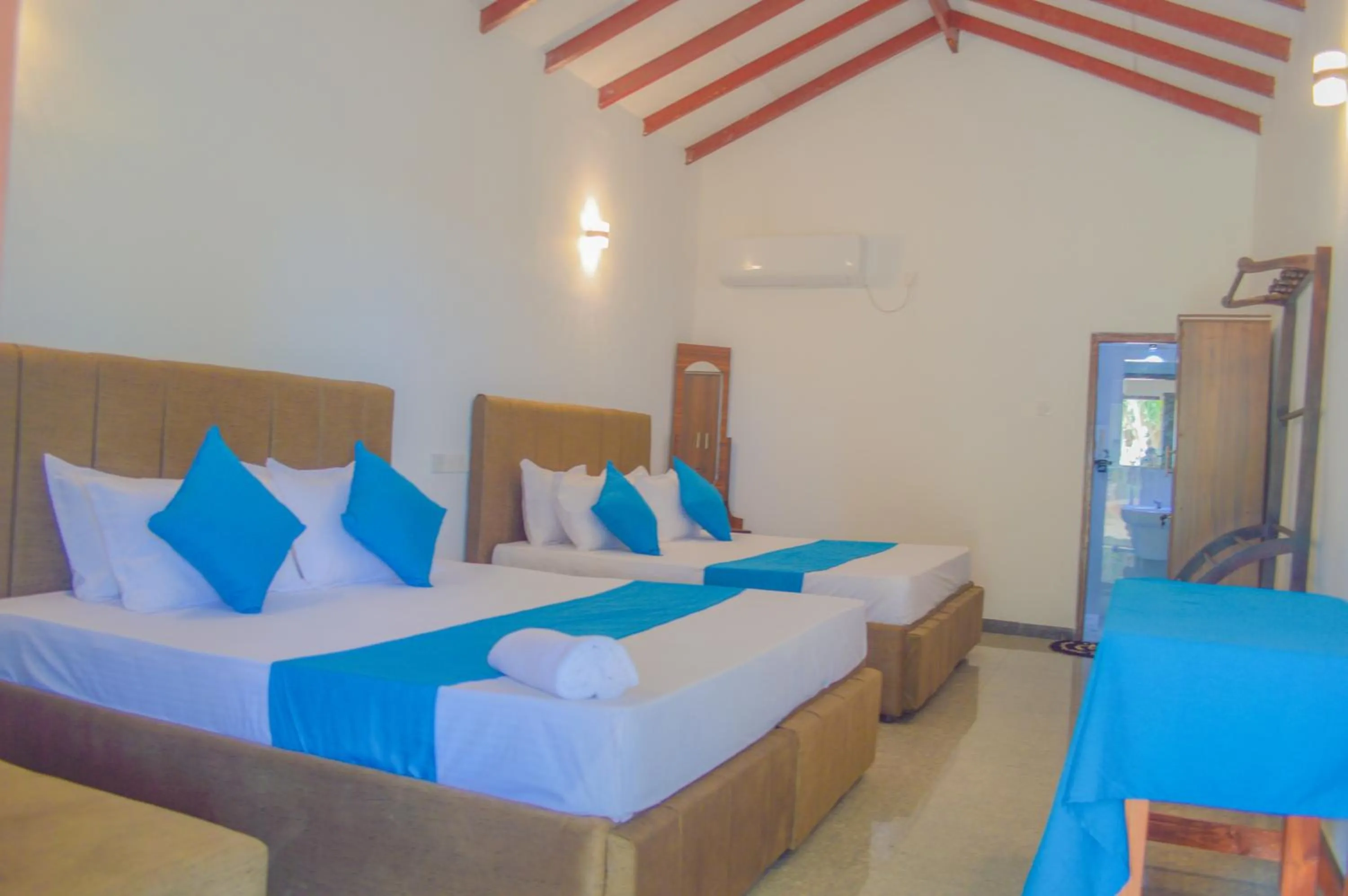 Photo of the whole room, Bed in Blue Water Paradise Akurala