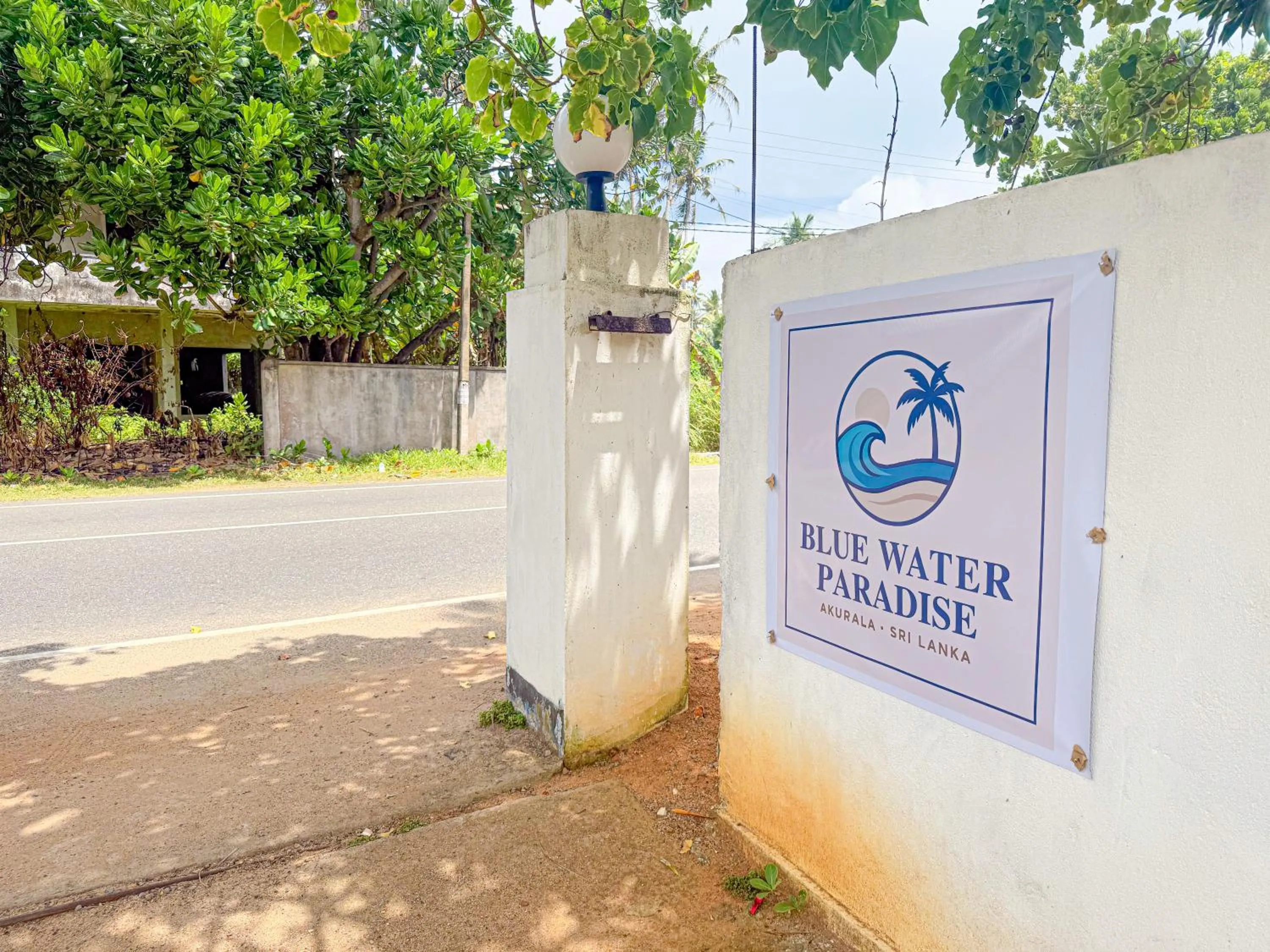 Property logo or sign in Blue Water Paradise Akurala