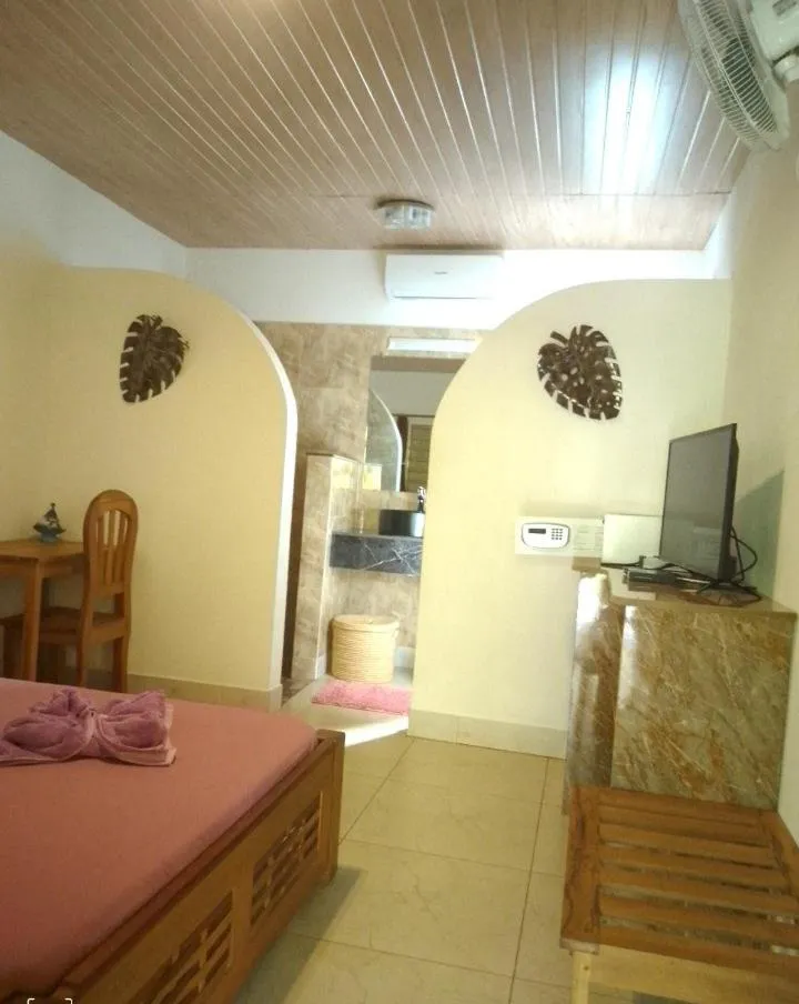 Bed in Tropic Hôtel