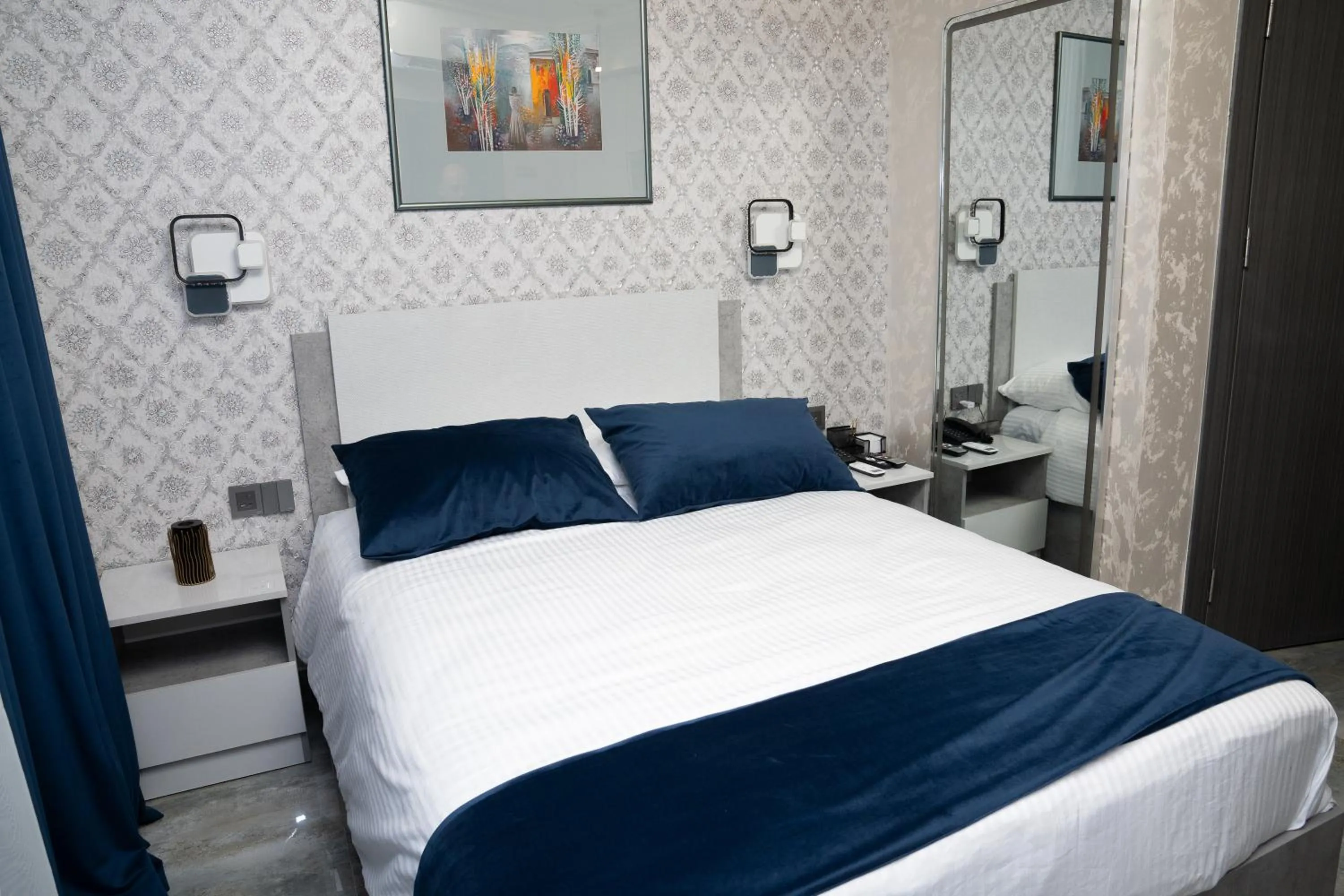 Bed in Prime Suites Hotel