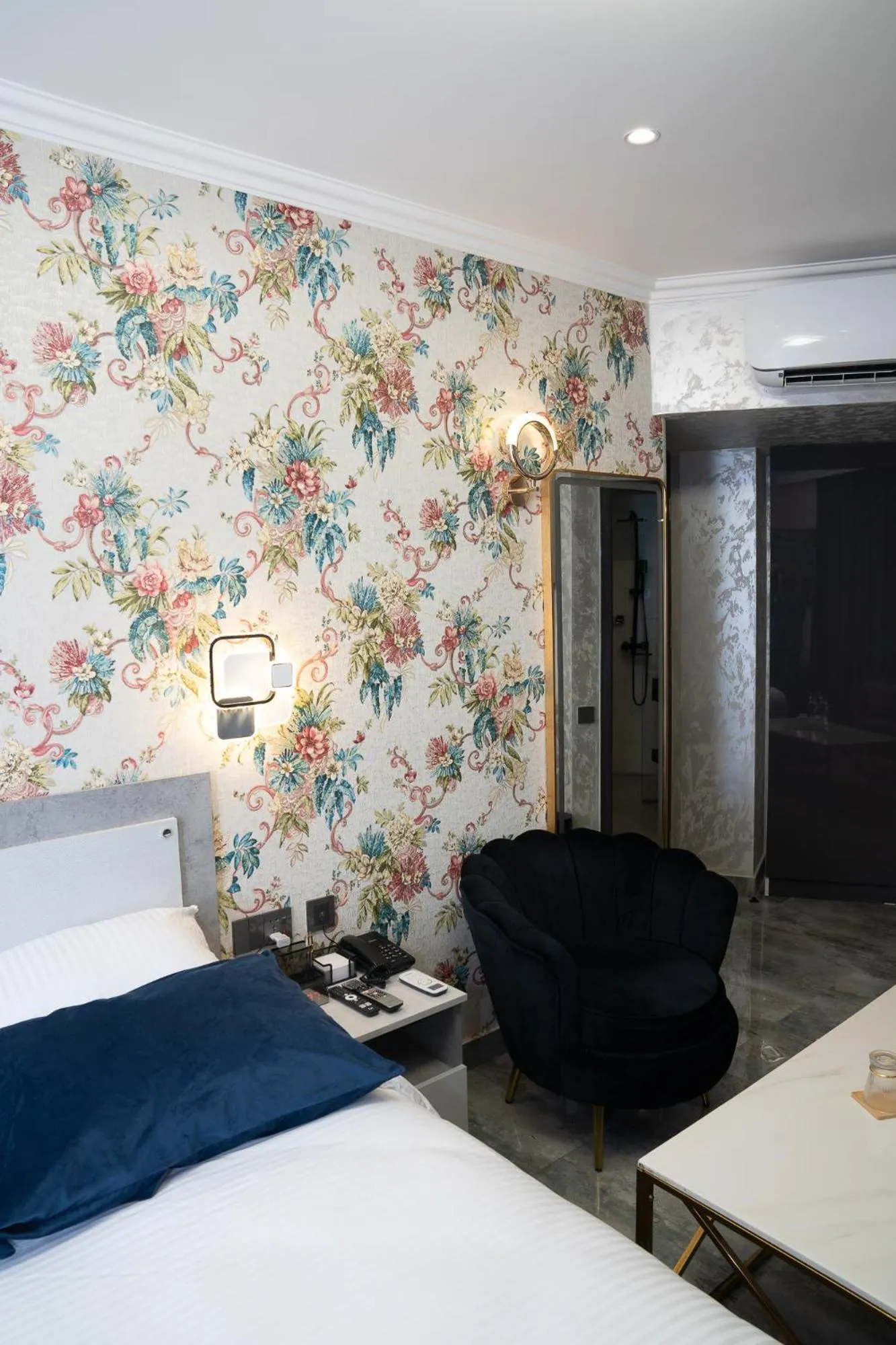 Bed in Prime Suites Hotel