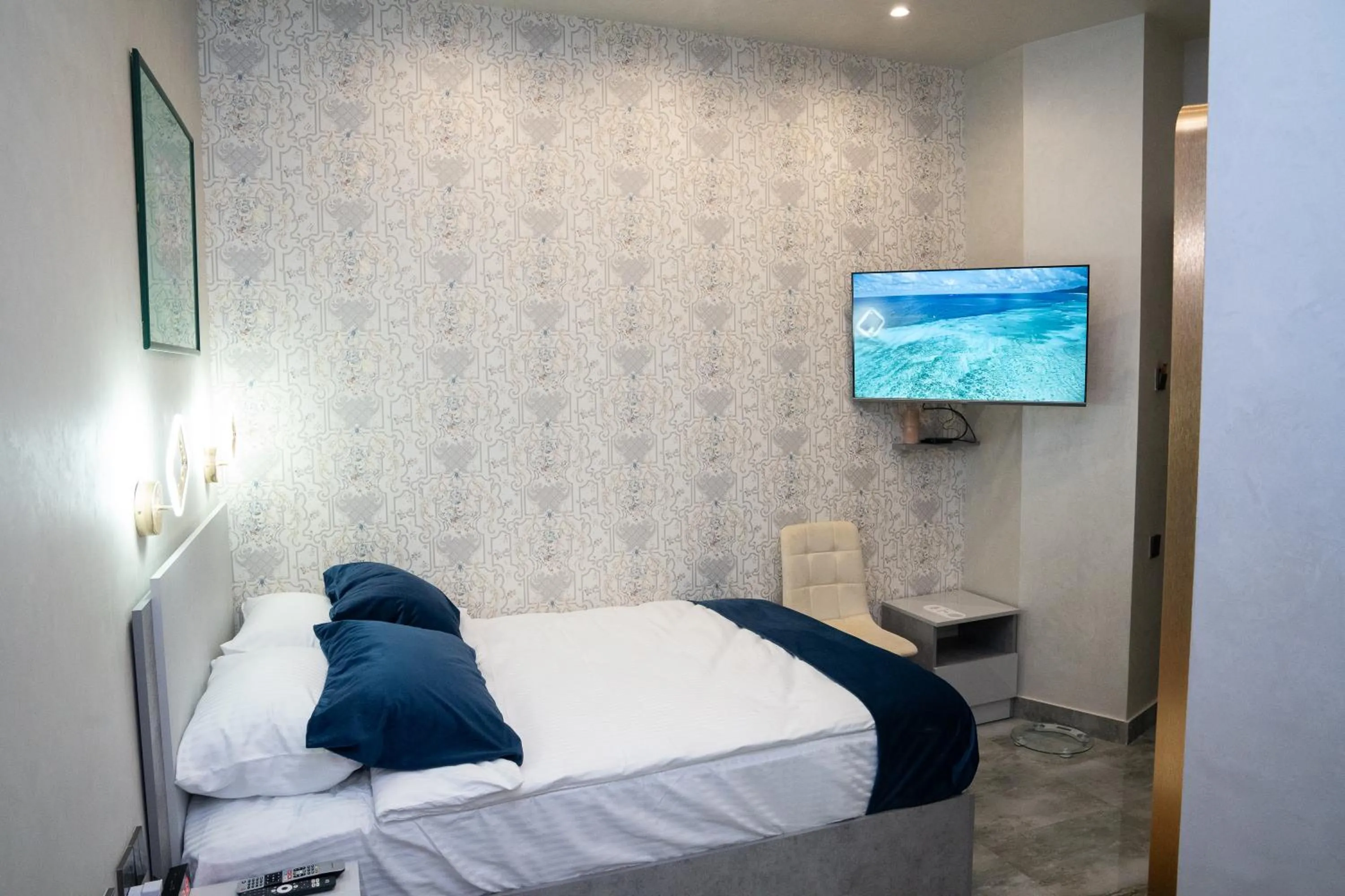 Bed in Prime Suites Hotel