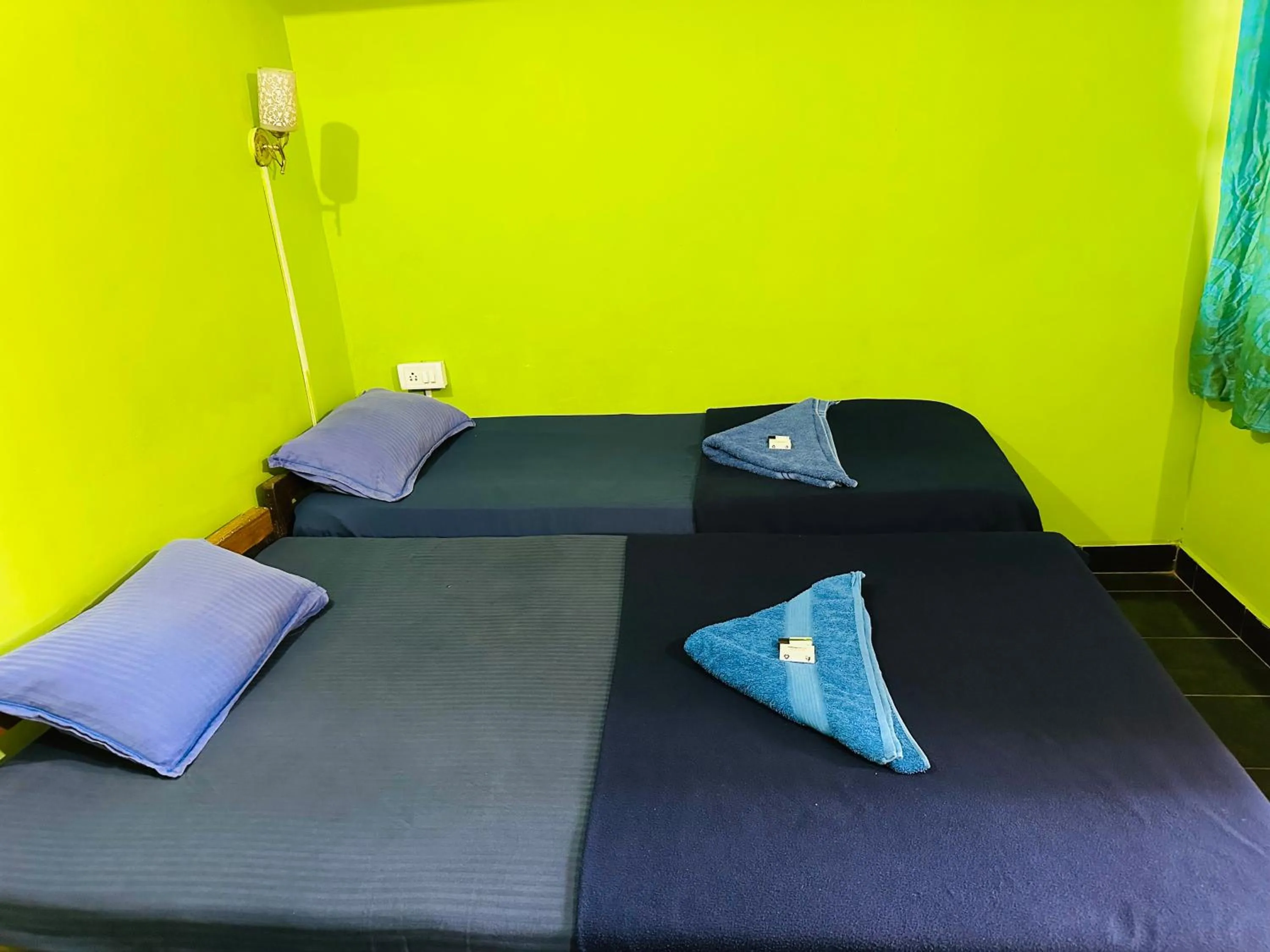 Bed in Savitri Guest House