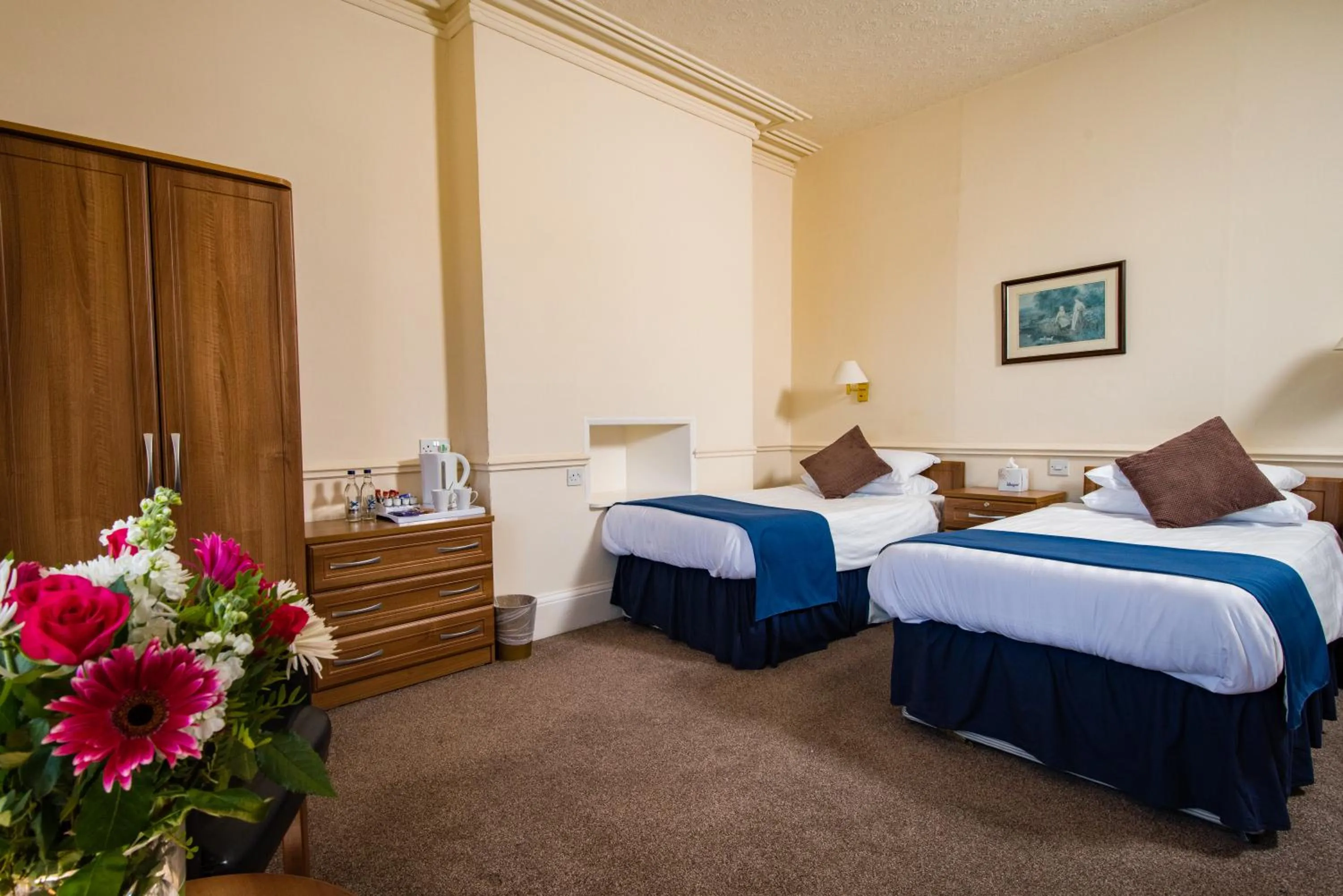 Bed in Abbey Lawn Hotel